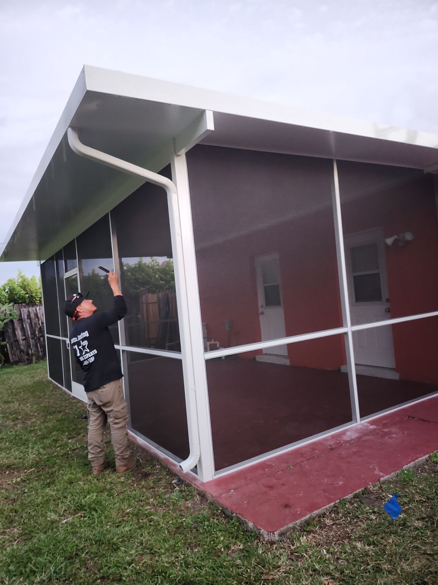Insulated Screen Enclosure and Wood Tile Deck Installation in Plantation by Aastro Roofing