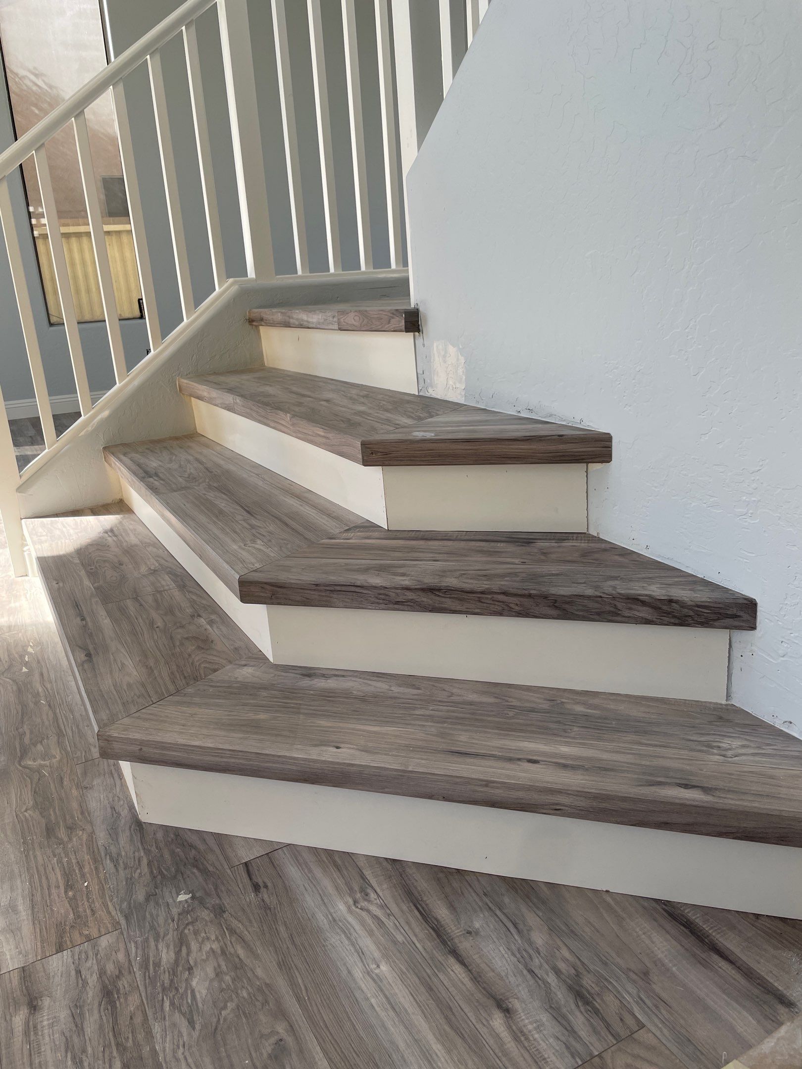 Laminate Staircase and Flooring  by Footprints Floors of Chandler 