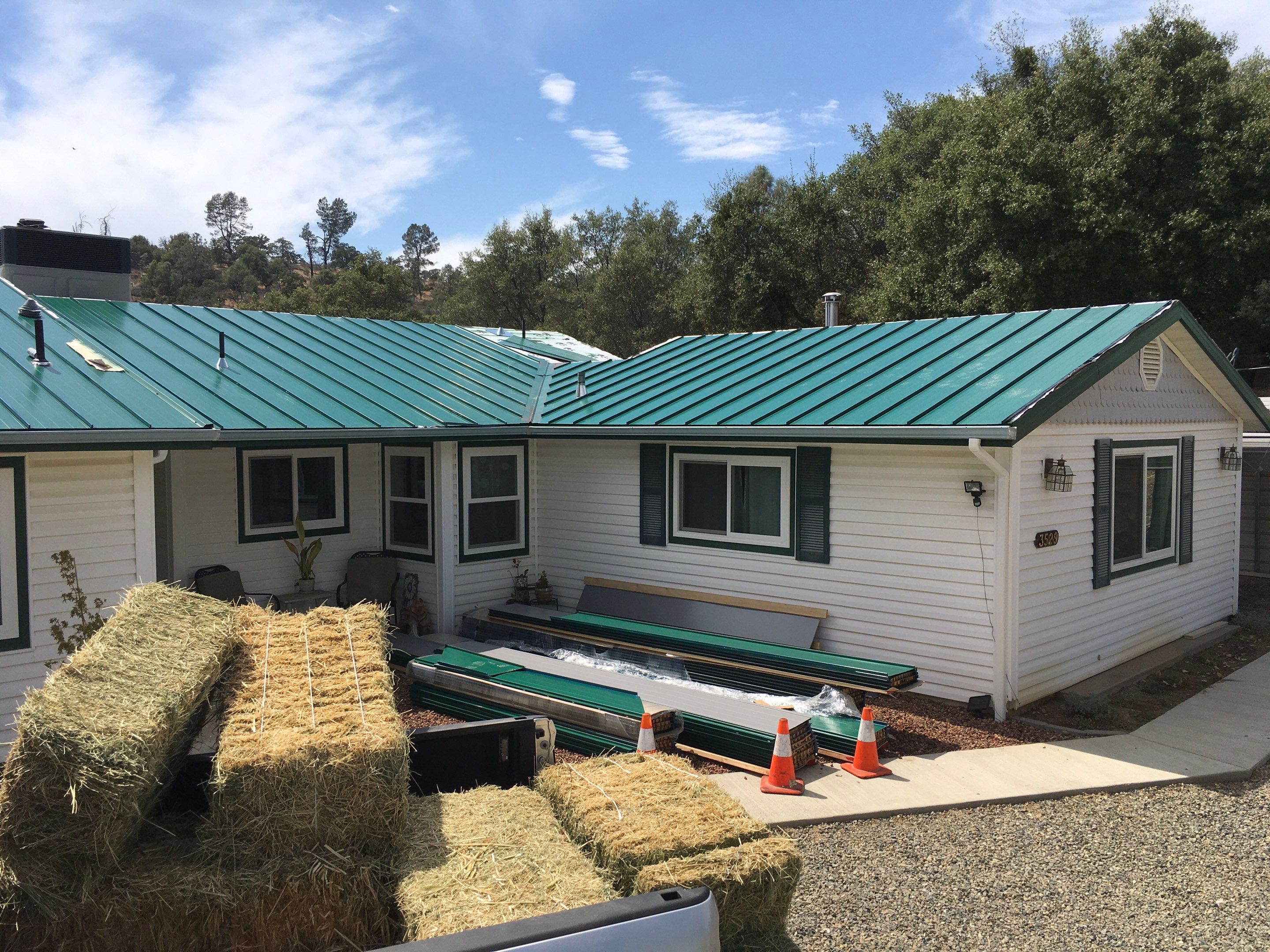 Metal roofing installation using Standing seam metal roofing system by Straight Edge Roofing Inc
