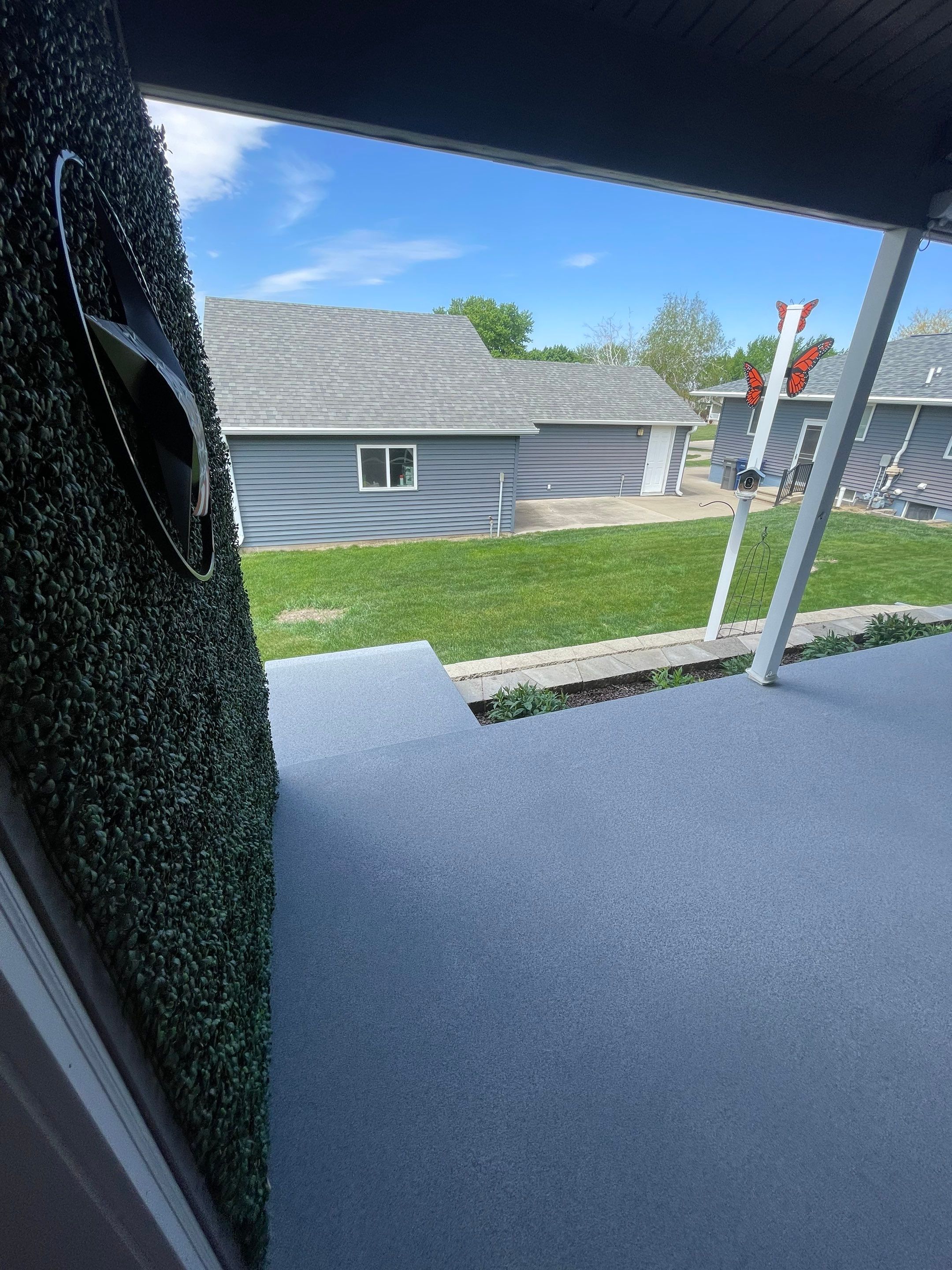 Custom Grey Flake Epoxy Garage Floor Installation in Remsen by Select Painting, Coatings & Garage Cabinets