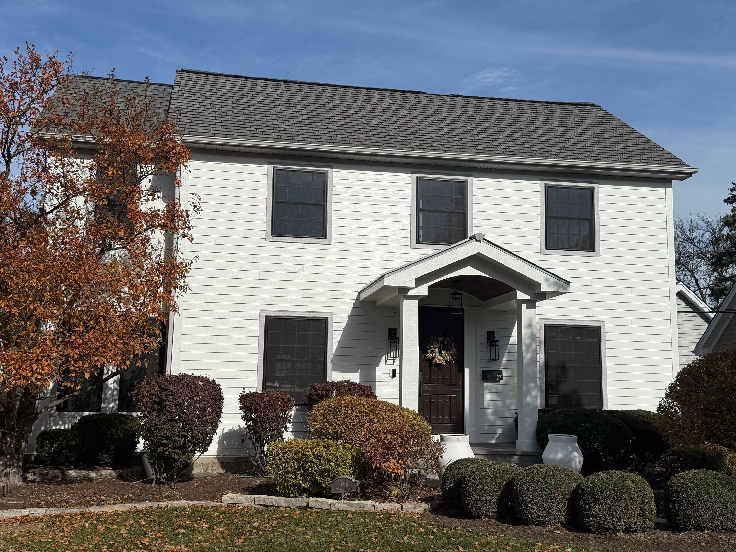 Exterior Renovation in Elmhurst with James Hardie Siding and Windows by Great American Exteriors
