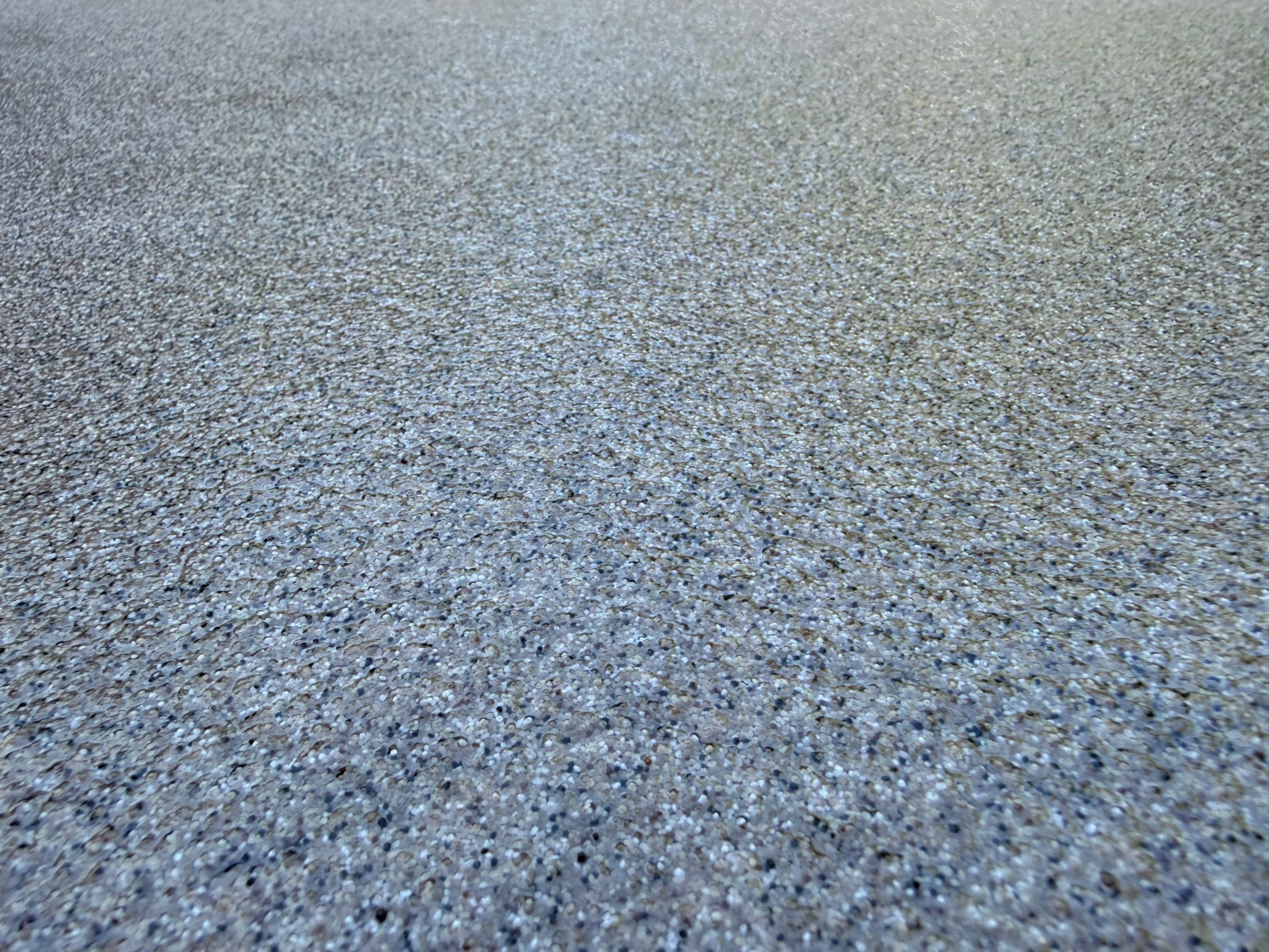 Textured Concrete Coating and Paver Patio Refresh in Sioux Falls by Select Painting, Coatings & Garage Cabinets