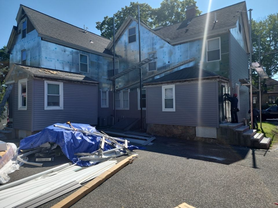 Vinyl siding layover project for 2 family in Wellesley, MA by UBrothers Construction