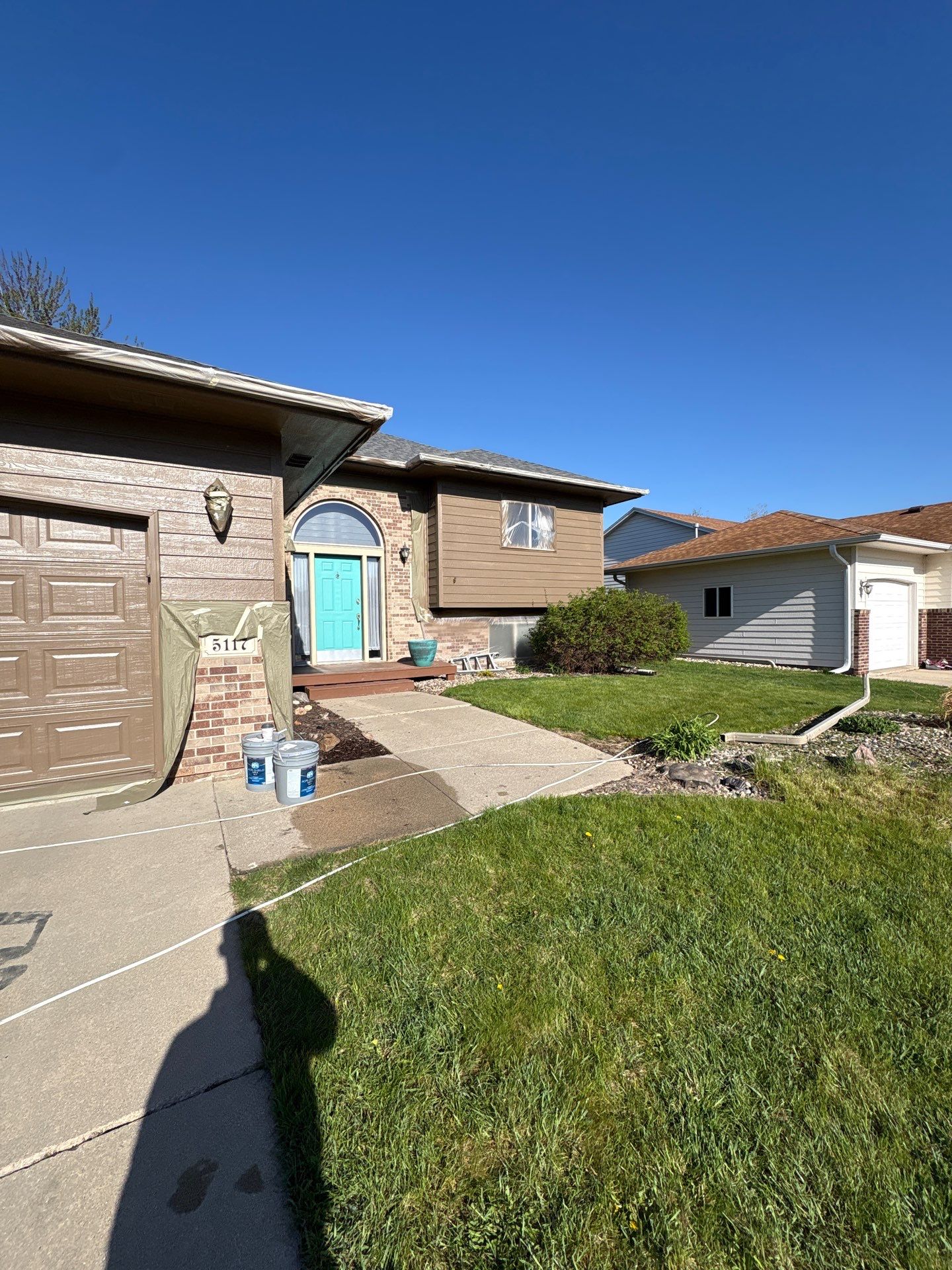 Exterior Painting and Wood Trim Replacement in Sioux Falls by Select Painting, Coatings & Garage Cabinets