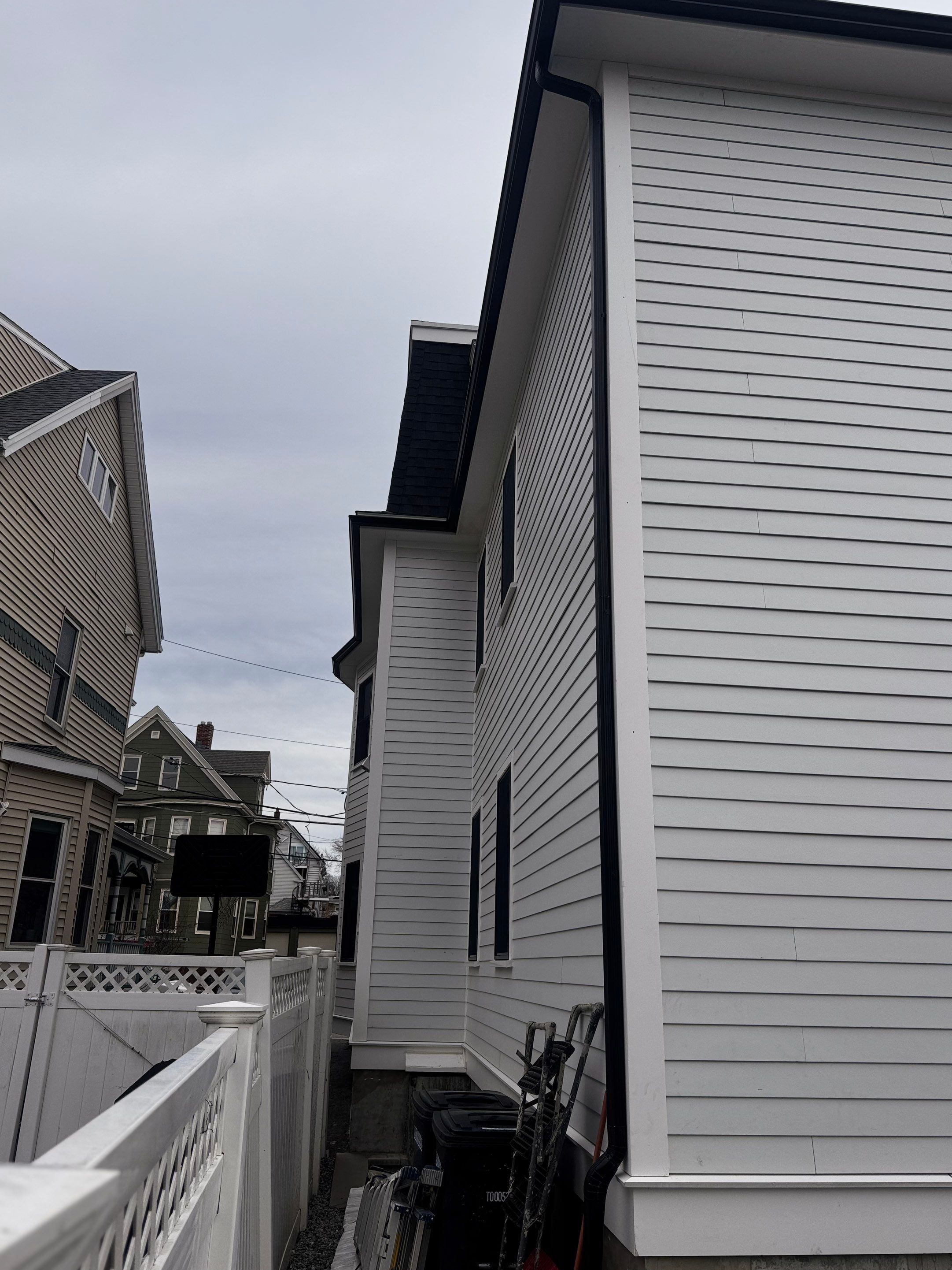 Black Gutter Installation by JOHNNYS PRO