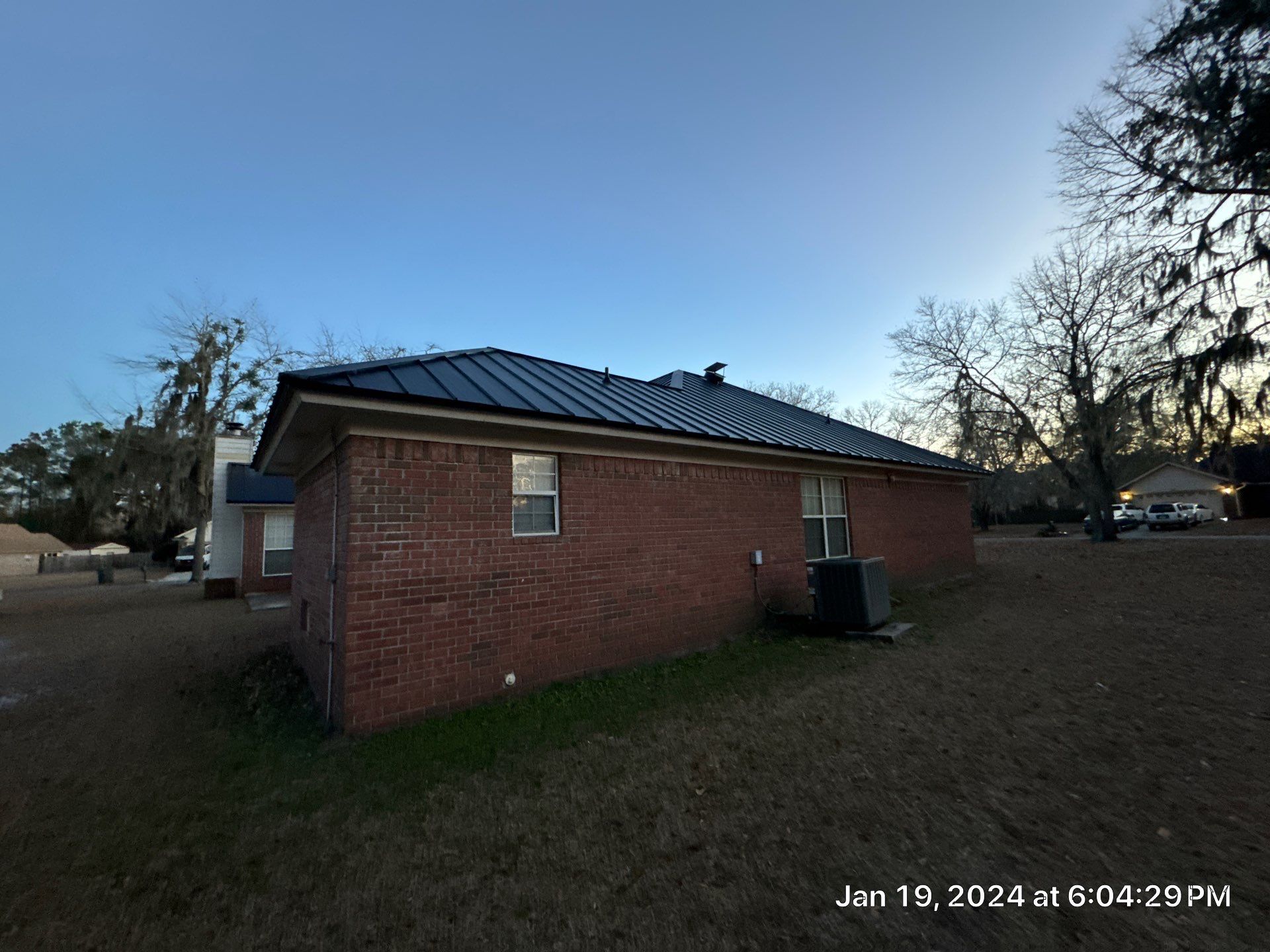 Residential Roofing Installation using Benton 26Ga 1inc Snapcock Metal Roof KYNAR Matte Black by Talya Roofing
