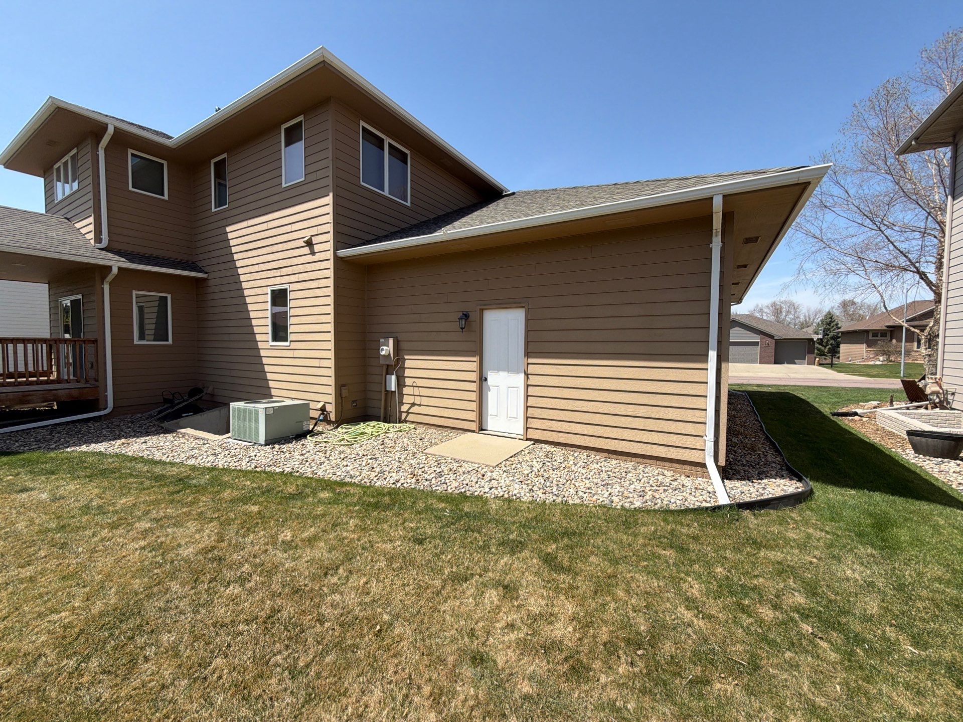 Full Exterior House Painting and Deck Staining in Sioux Falls by Select Painting, Coatings & Garage Cabinets