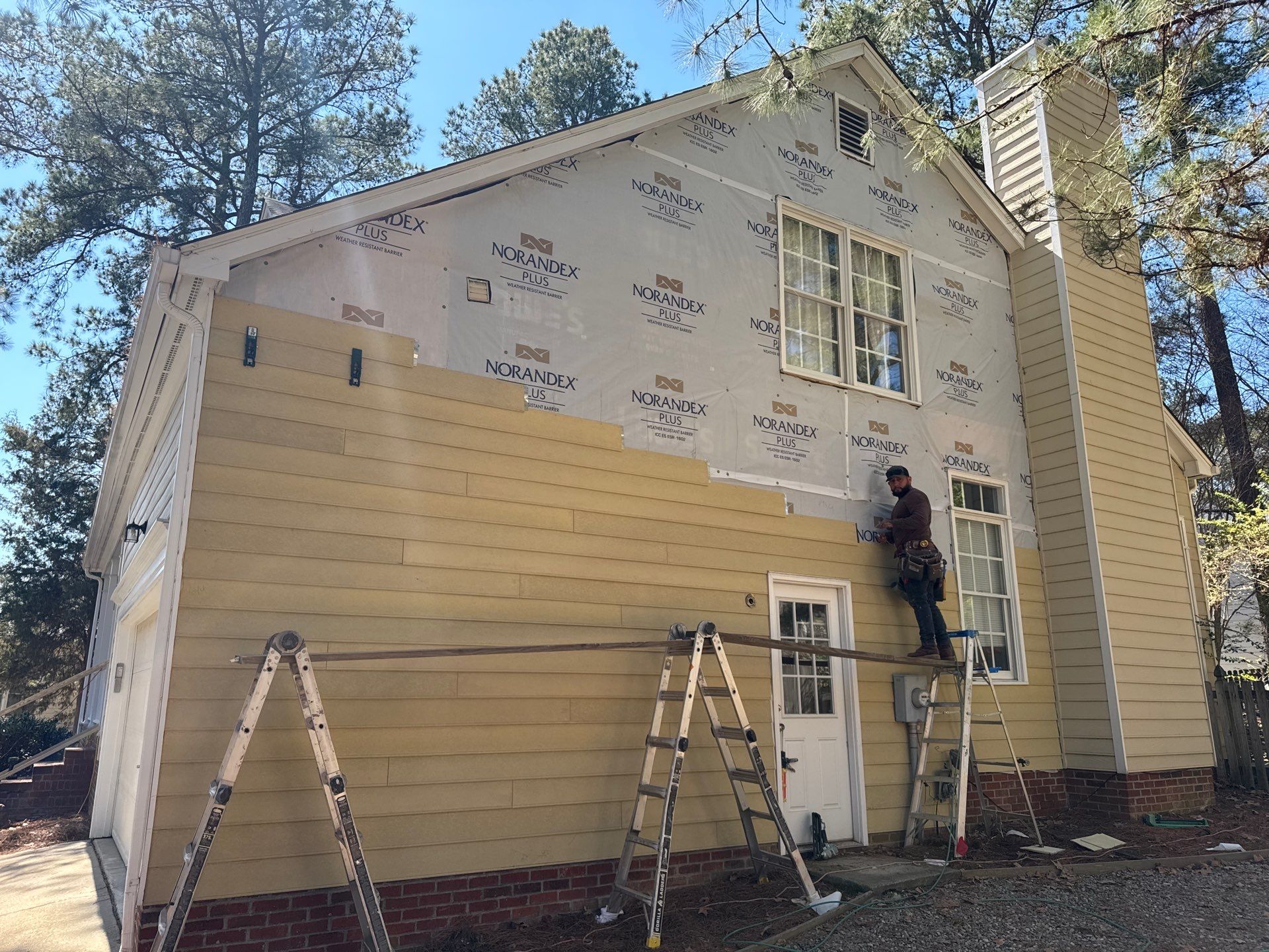 Exterior paint and siding replacement by GonzalezPainters & Contractors Inc 