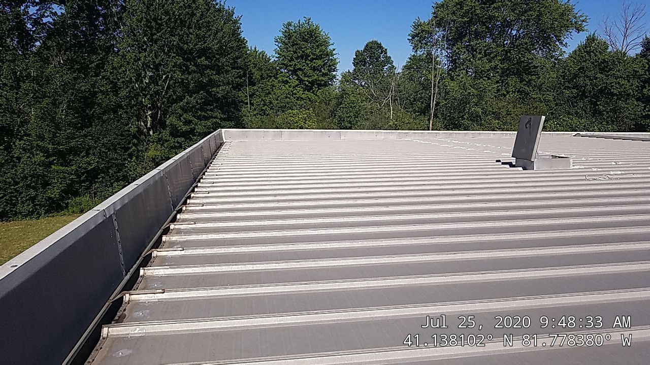 Commercial Metal Roof Coating by Gold Star Roofing LLC