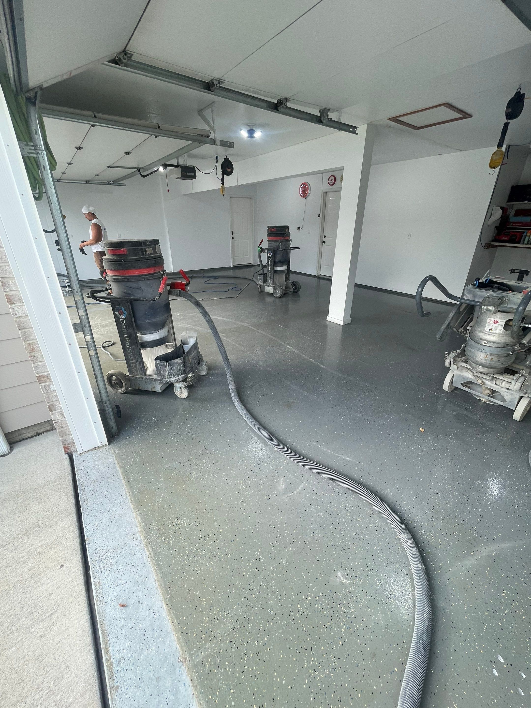 Multi-Car Garage Concrete Coating with Coyote Flake Finish in Sioux Falls by Select Painting, Coatings & Garage Cabinets