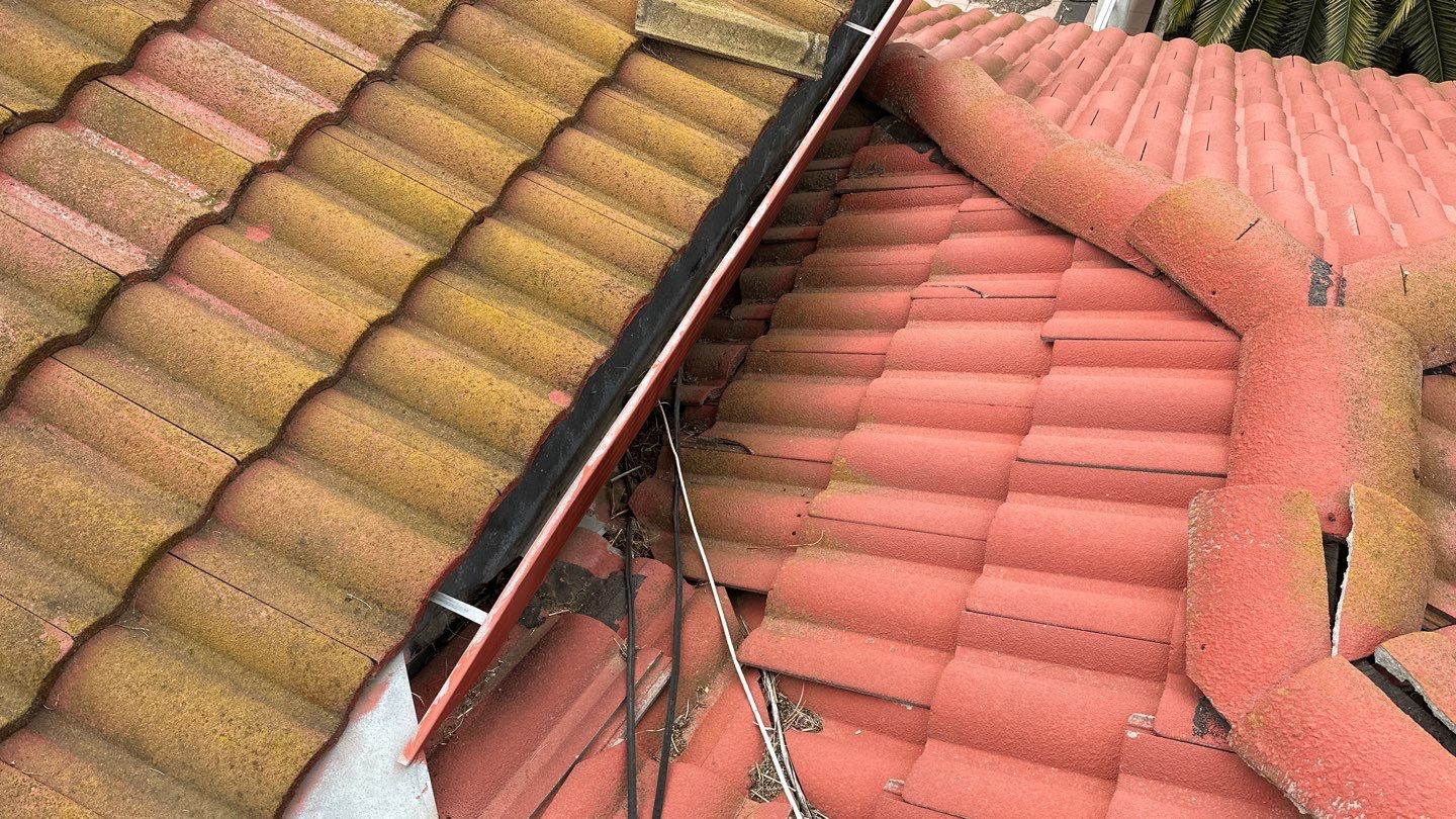 Tile refurbish project using existing tiles and replaced underlayment and battens by Straight Edge Roofing Inc