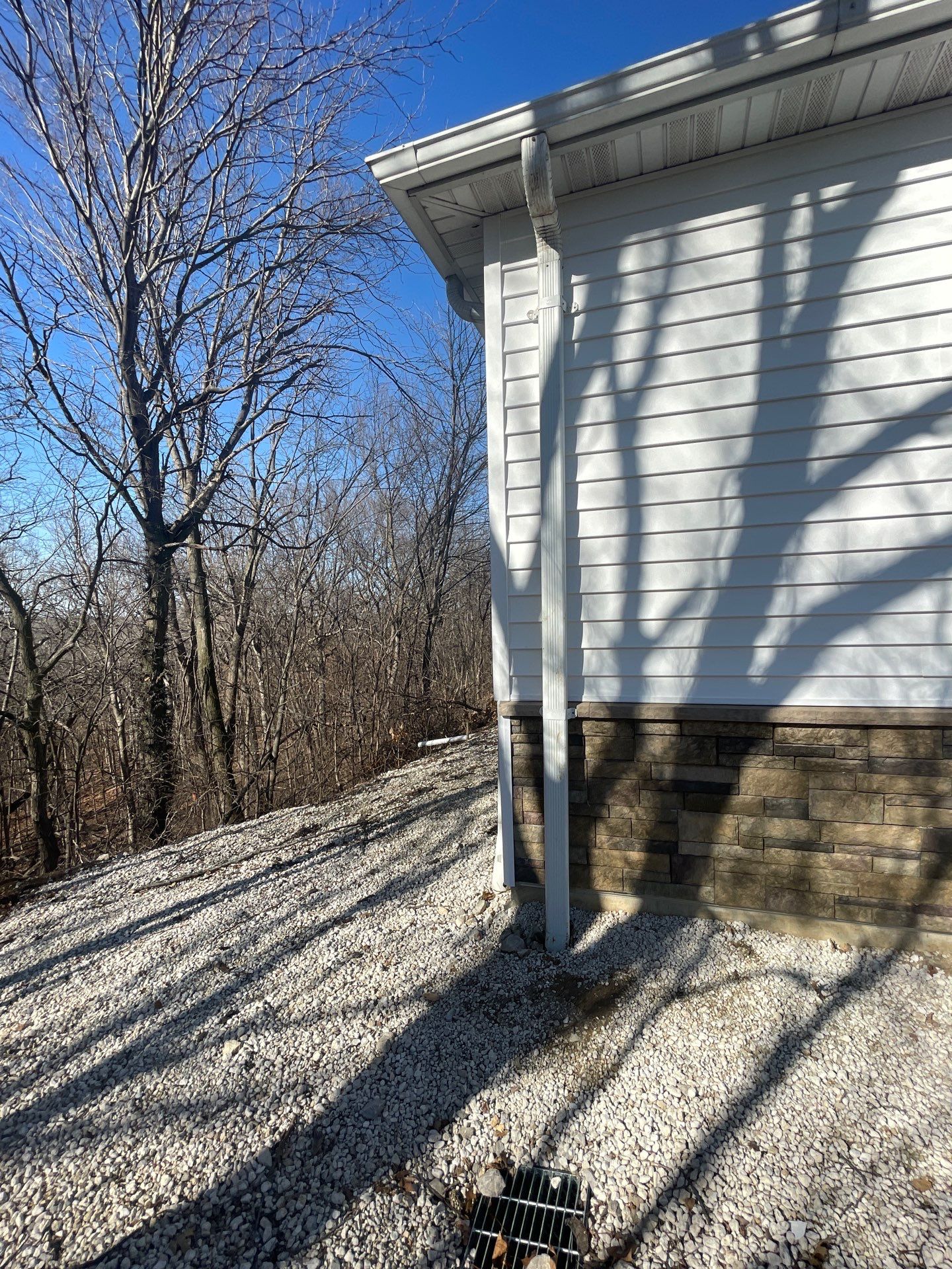 Siding and Stone Installation using Extrerior Porfolio Vinyl Siding and Versetta Stone by EEC  Windows, Siding & Roofing 
