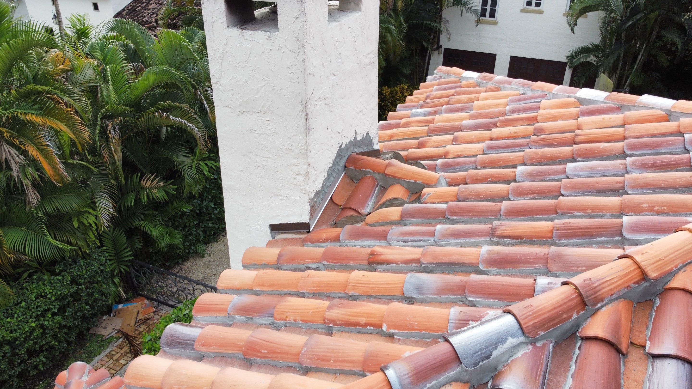 Residential Roofing Installation using Two Piece Clay Barrel Tile with a mortar set application by BOB HILSON & CO INC