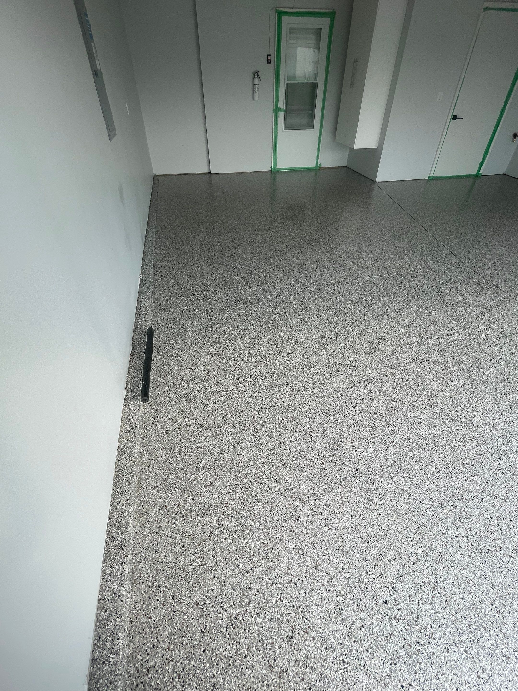 Custom Coyote Flake Garage Floor Coating in Sioux Falls by Select Painting, Coatings & Garage Cabinets