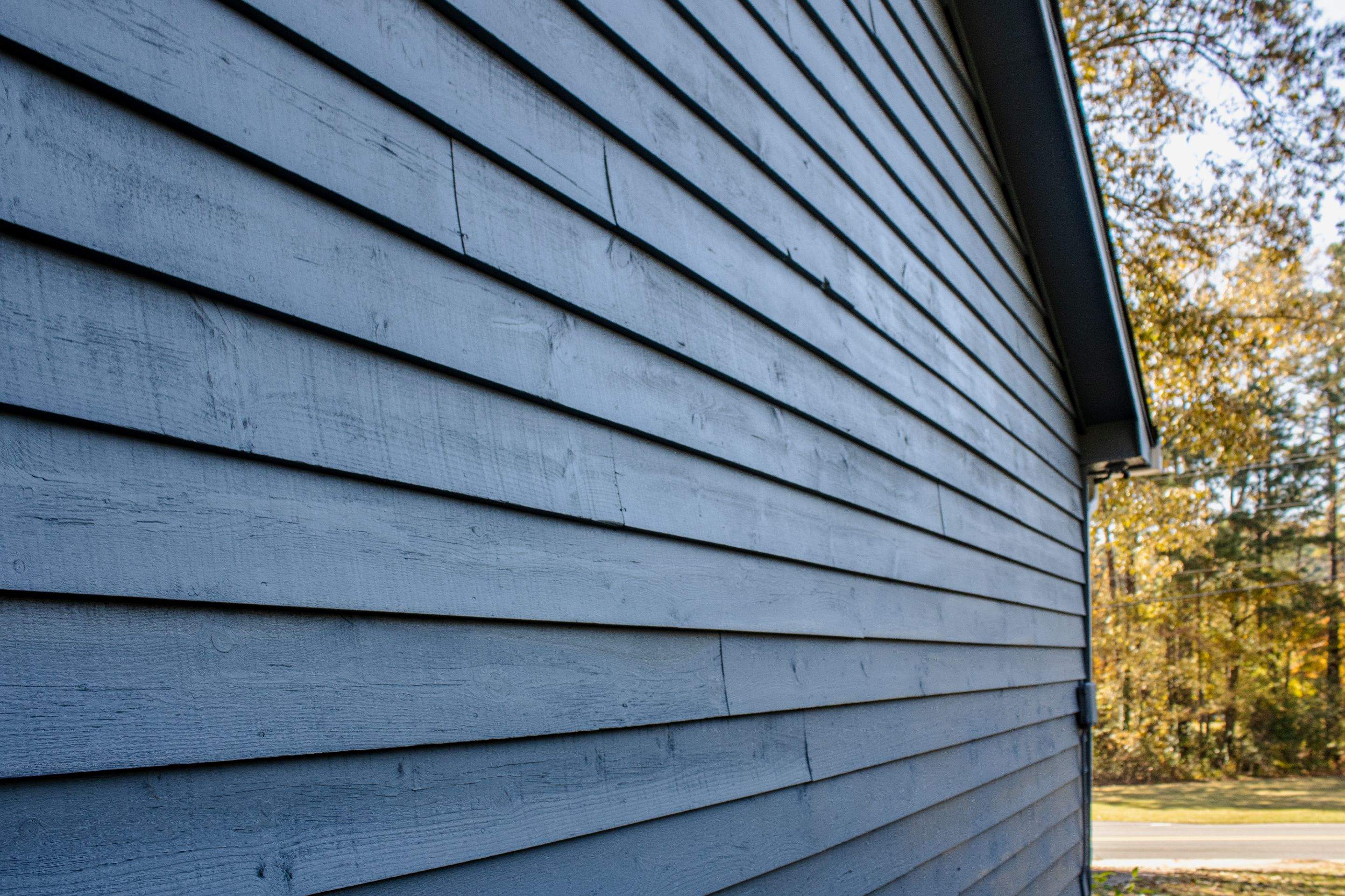 Marietta, GA Exterior Painting Transformation with Blue Paint by Nelson Exteriors