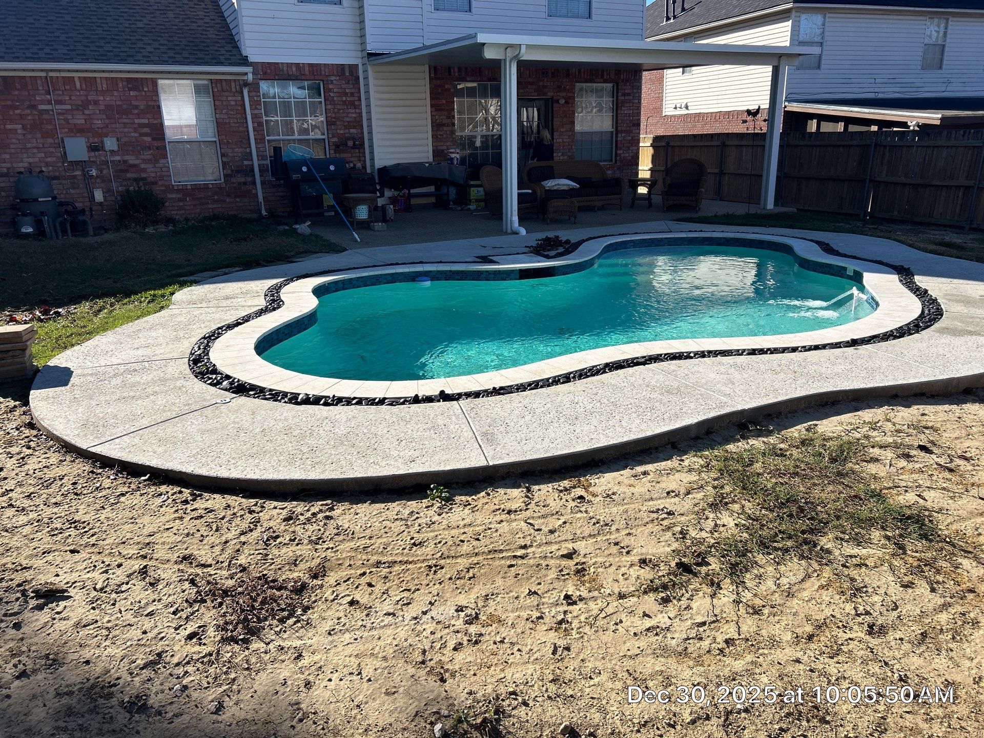 Compact Freeform Spool with Dark Coping by Pinnacle Pools and Spas - DFW