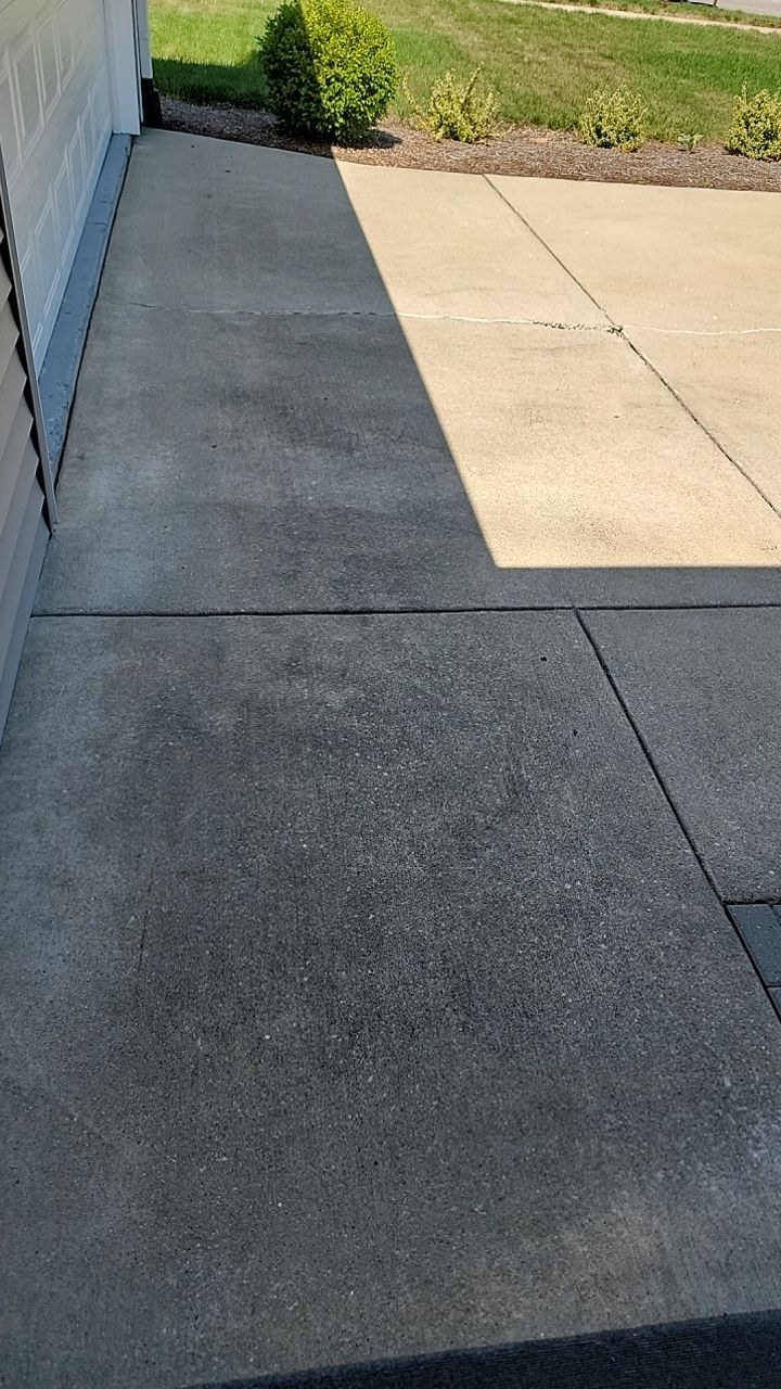 Oil extraction from concrete driveway.  by Northern Power Washing LLC.