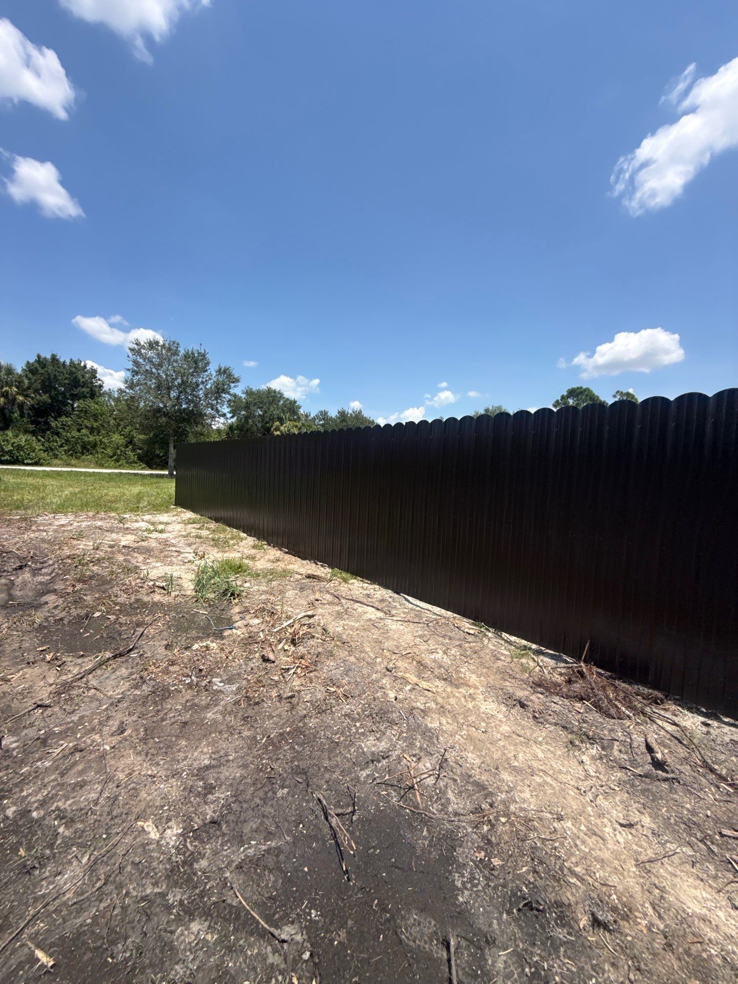 Black Scalloped Metal Privacy Fence Installation in Punta Gorda by True Fence LLC