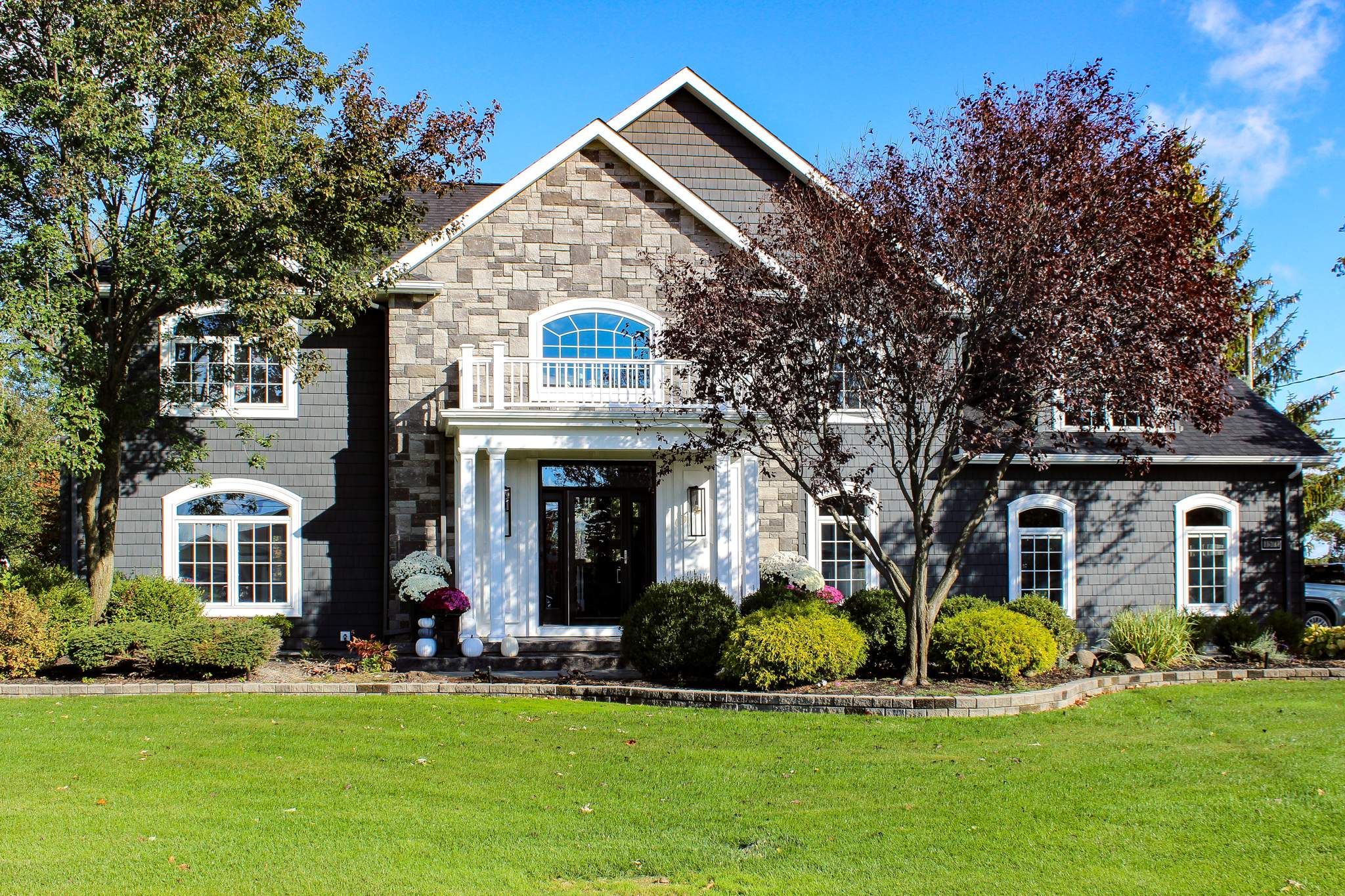 Exterior Renovations- Siding, Concrete, Railings, and Entry Door  by Ivy Lea Construction