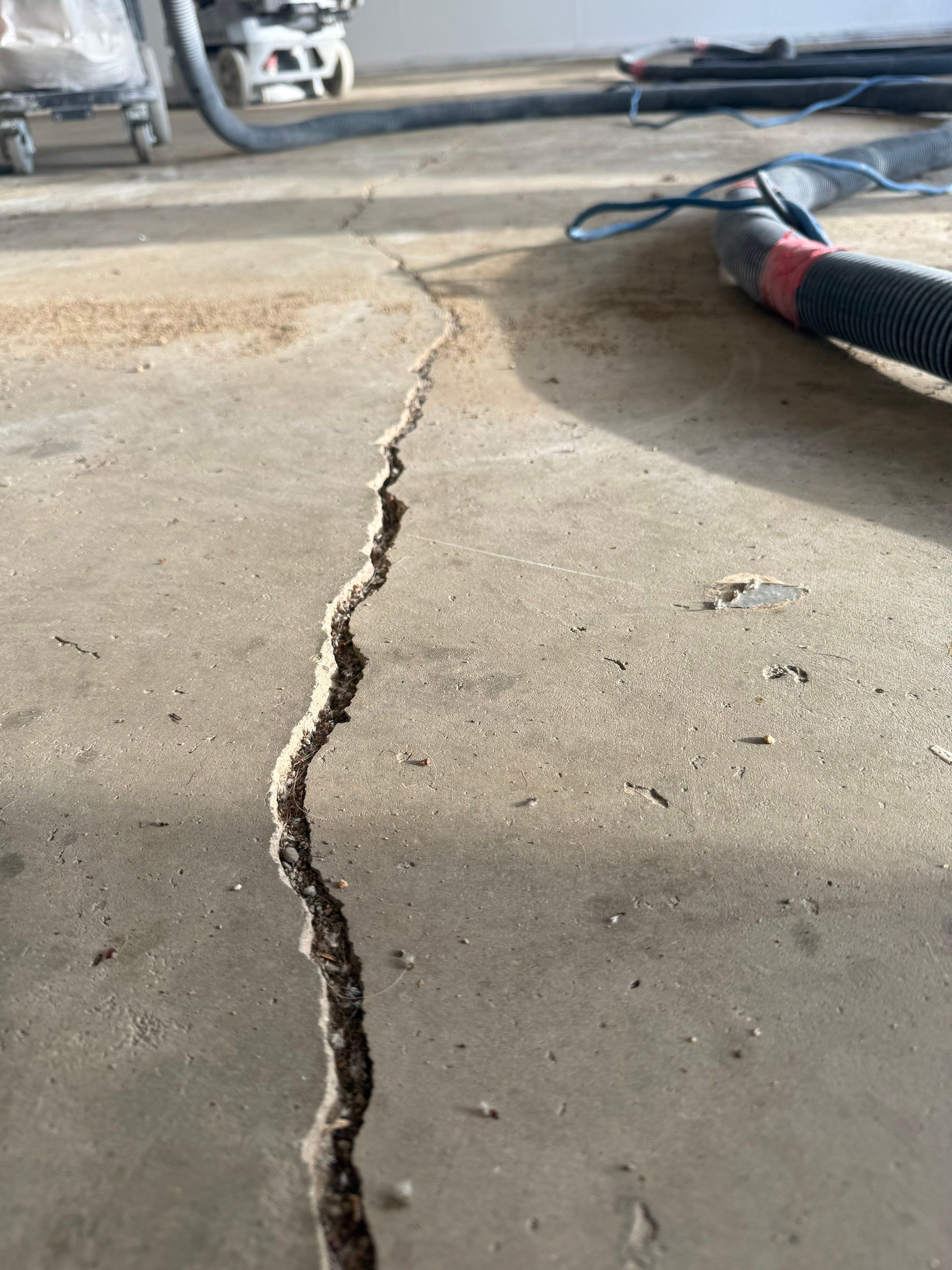 Feather Grey Garage Floor Coating and Crack Repair in Beresford by Select Painting, Coatings & Garage Cabinets