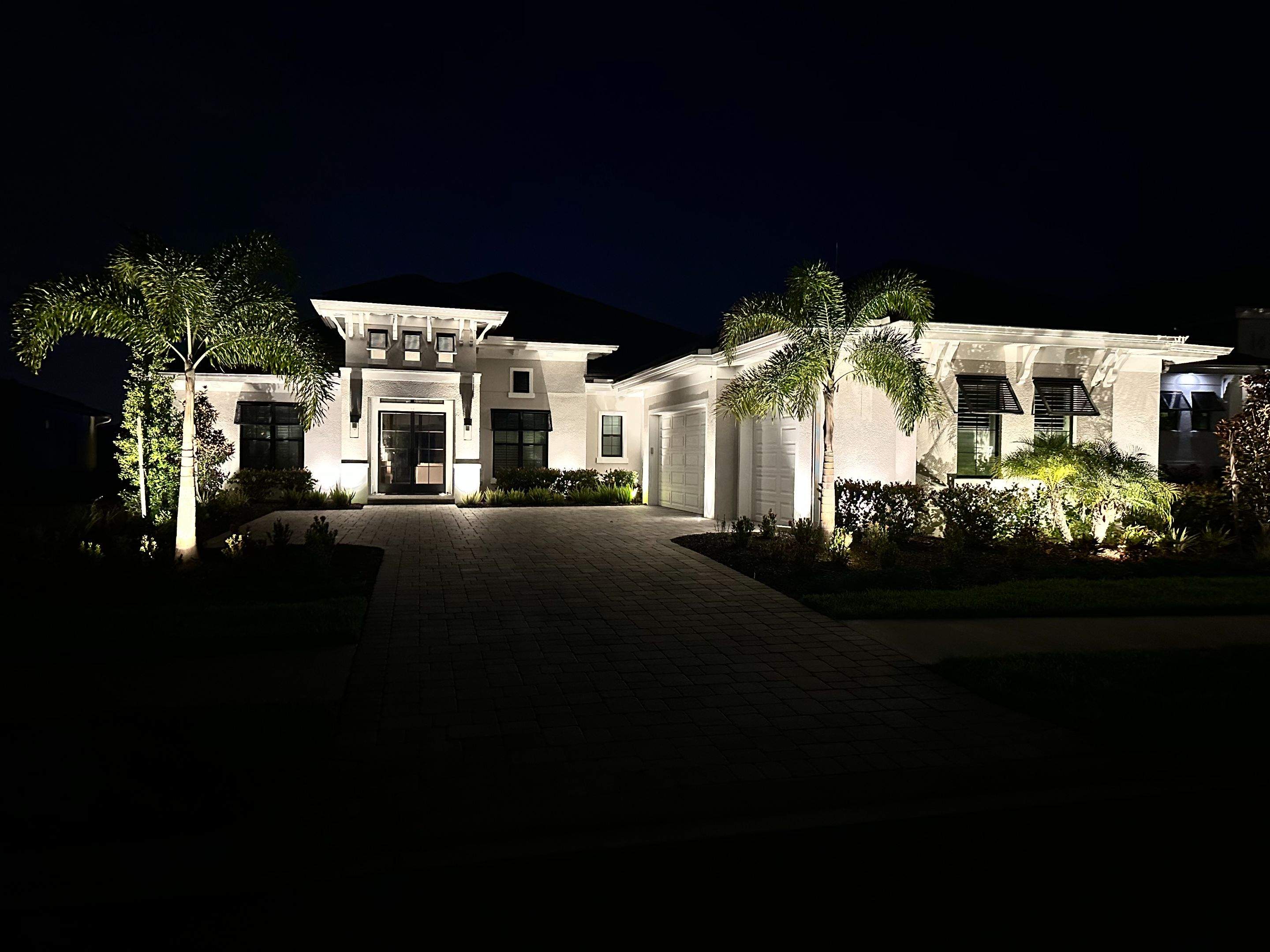 Architectural and Landscape Lighting Installation for Modern Sarasota Home by Illuminate Landscape Designs