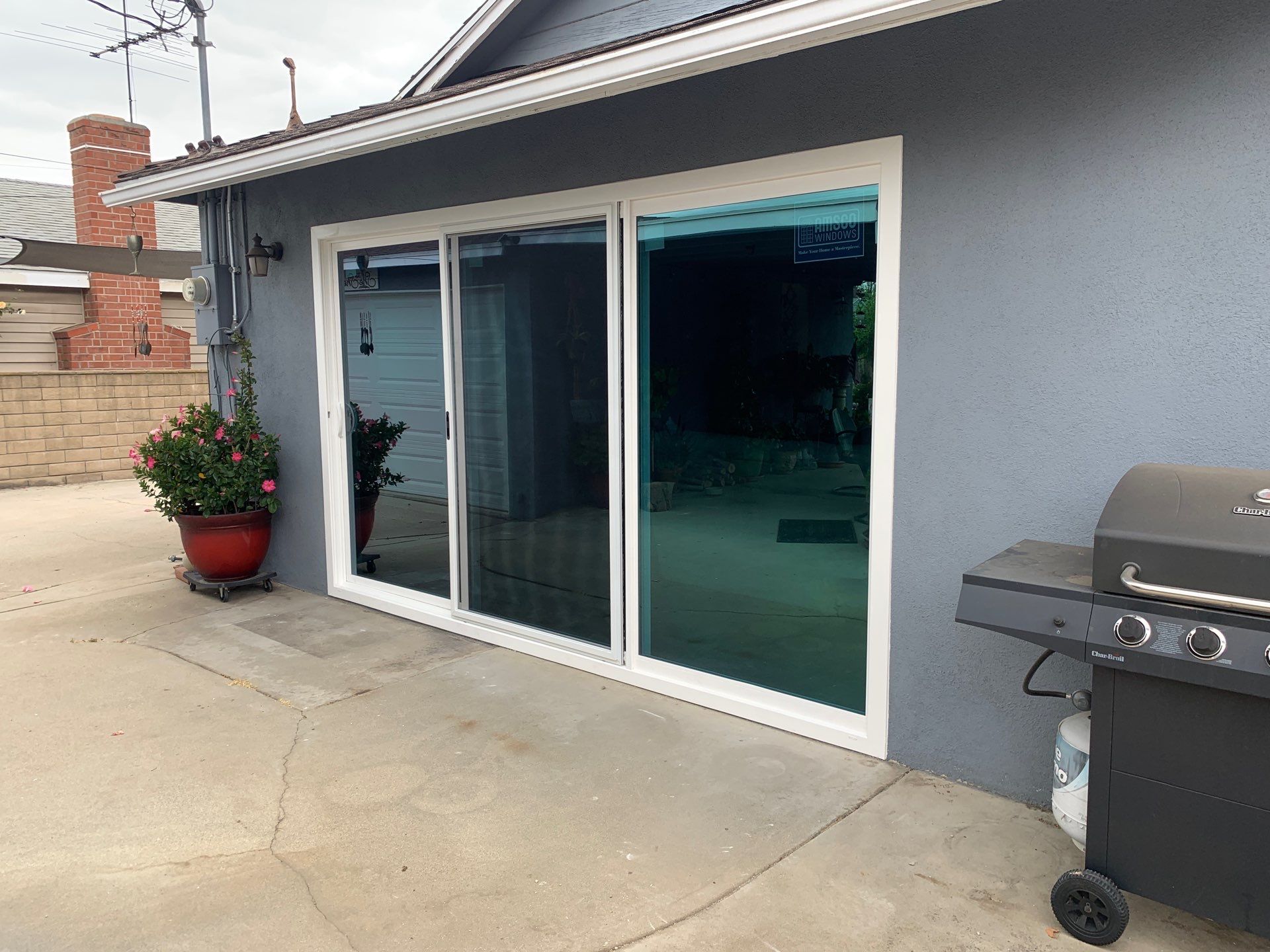 Patio door installation using Amsco Studio Series Vinyl by American Window Company