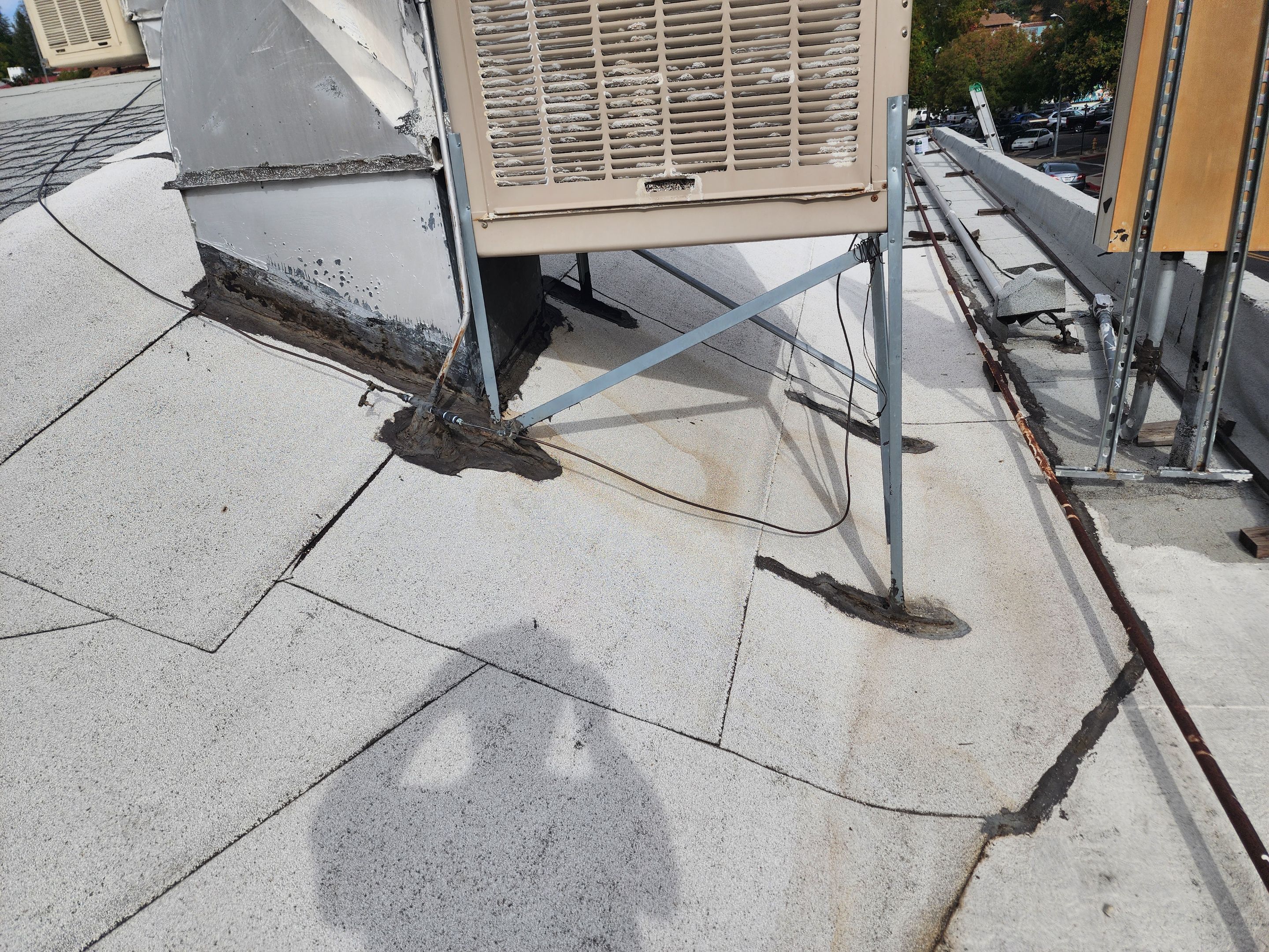 Foam and coatings on commercial roof by Straight Edge Roofing Inc