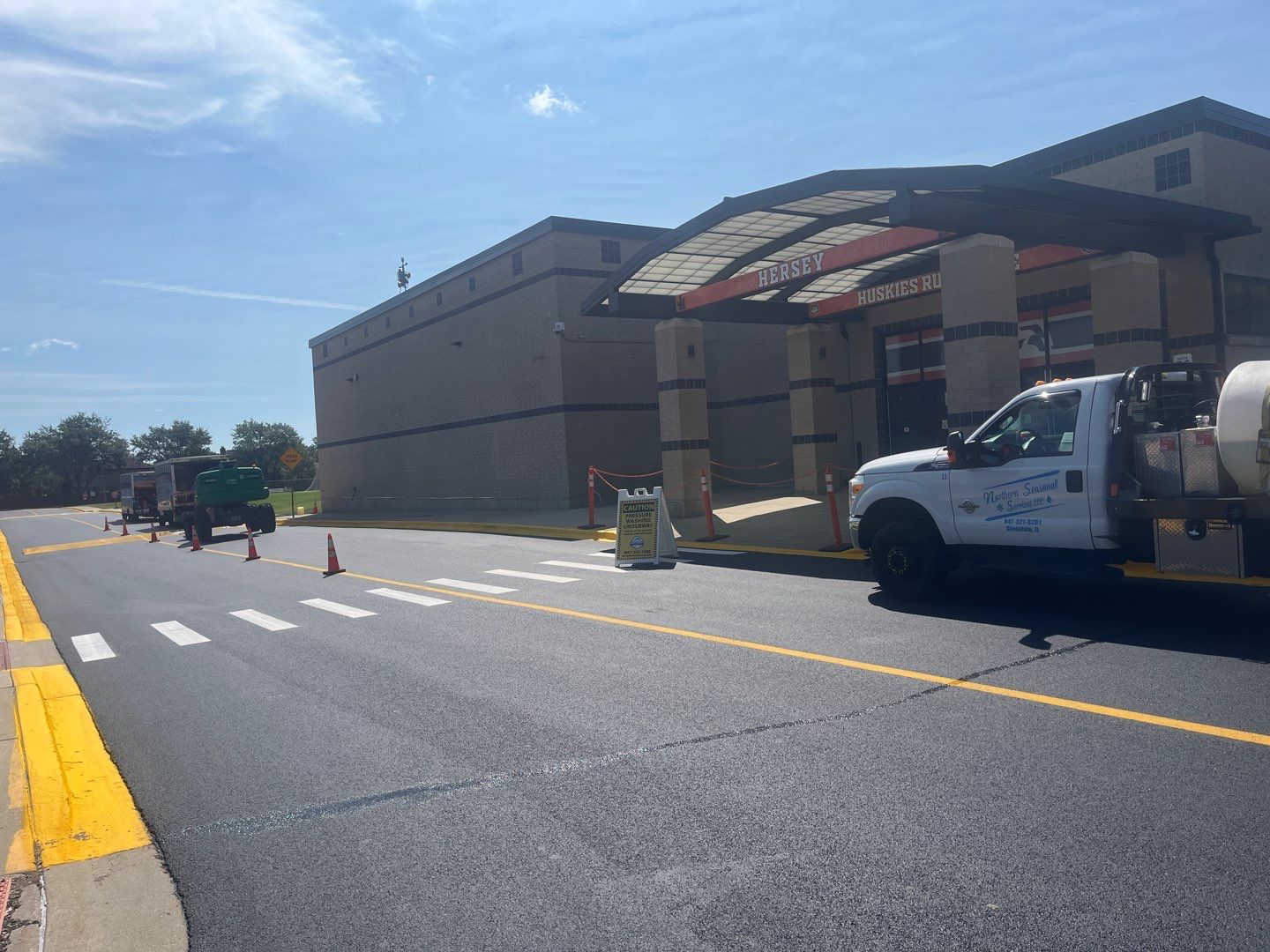 commercial pressure washing using Algaecide, soft wash soap by Northern Power Washing LLC.