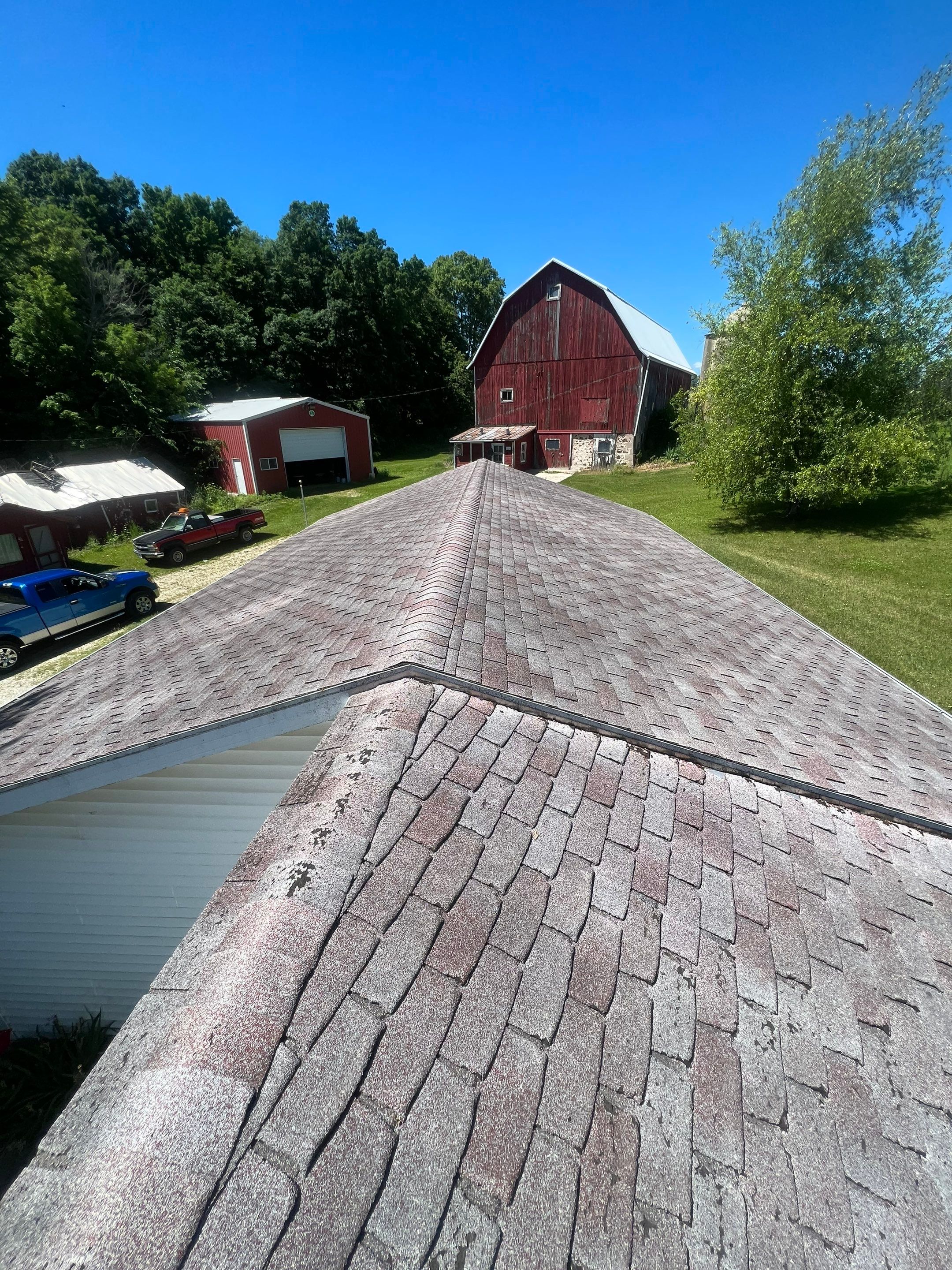 Residential Roof Installation with Red Pro Rib Metal Roofing in Adell, WI by Gellings Roofing & Siding