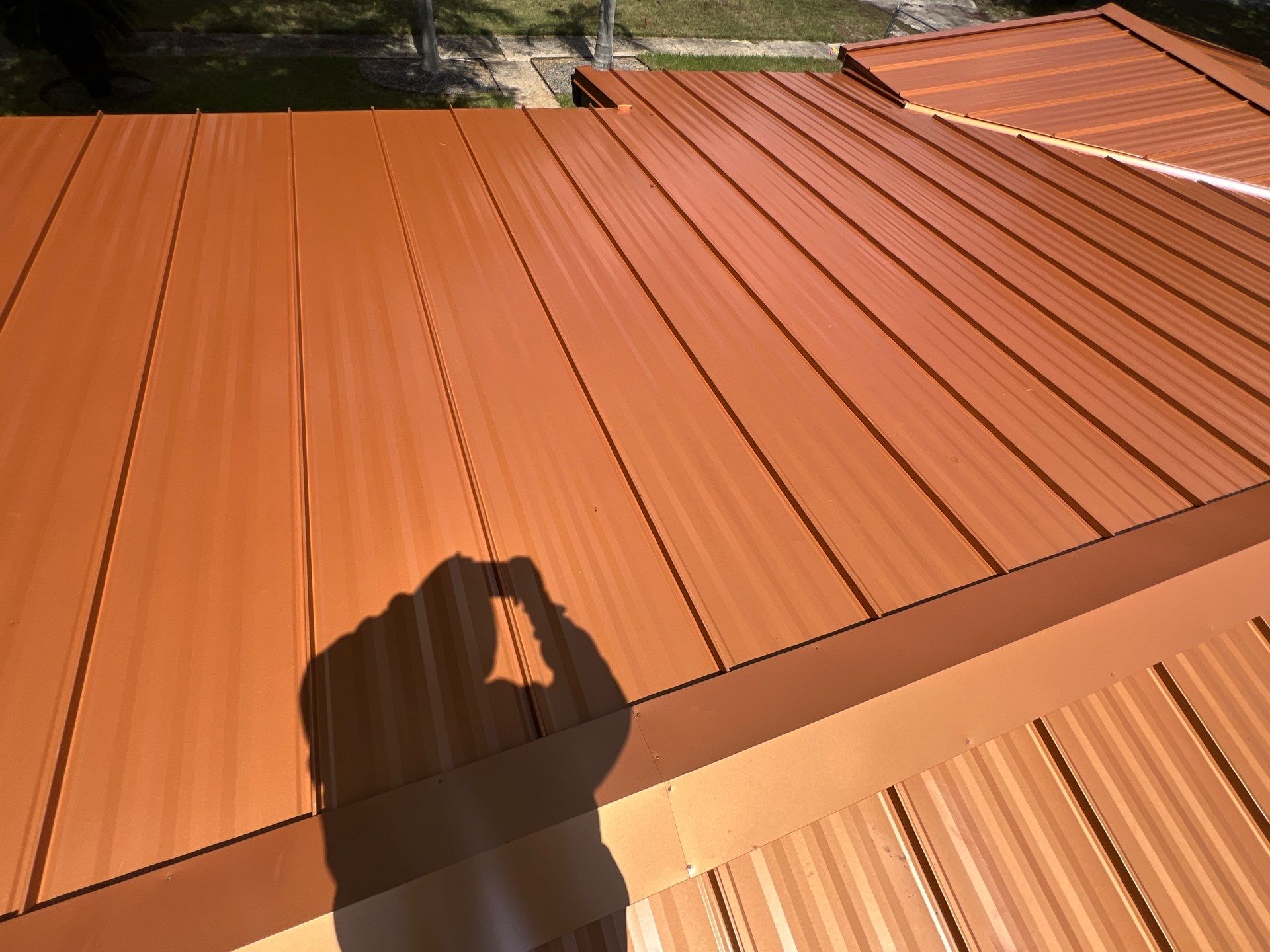 Standing Seam Metallic Copper Metal Roof Replacement in Deltona by Pinnacle Roofing Group