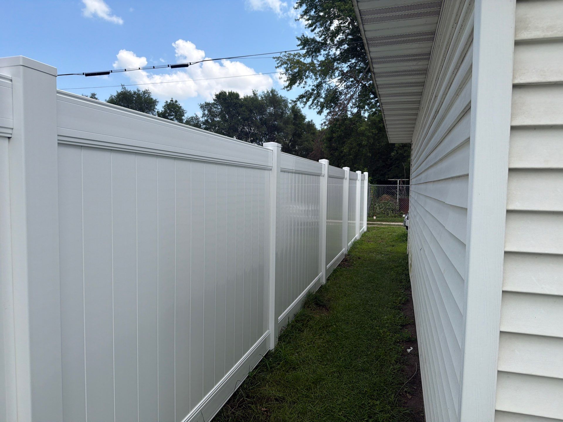 White Vinyl Privacy Fence Installation in Waterloo, Iowa by Perfect Picket Fence and Stain