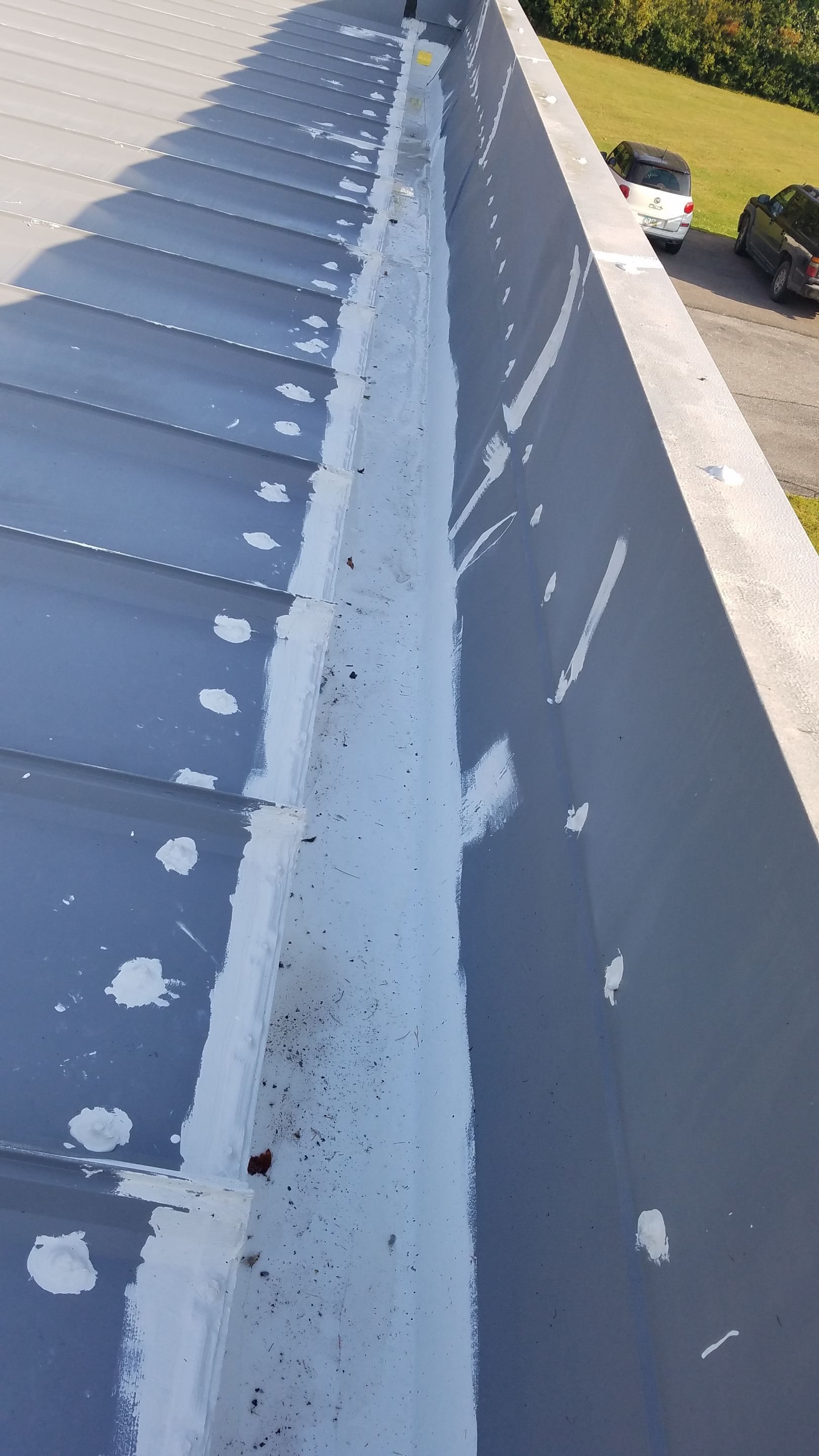 Commercial Metal Roof Coating by Gold Star Roofing LLC
