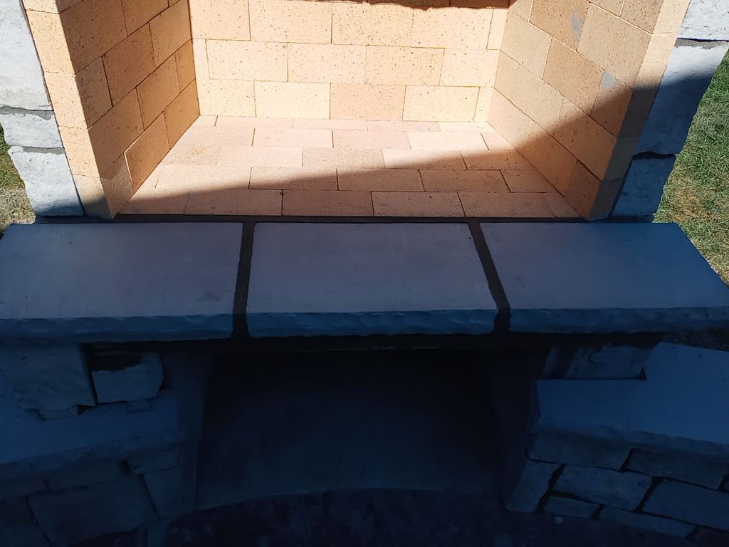 Back Yard Fireplace and Landscape by LAND ESCAPES LLC