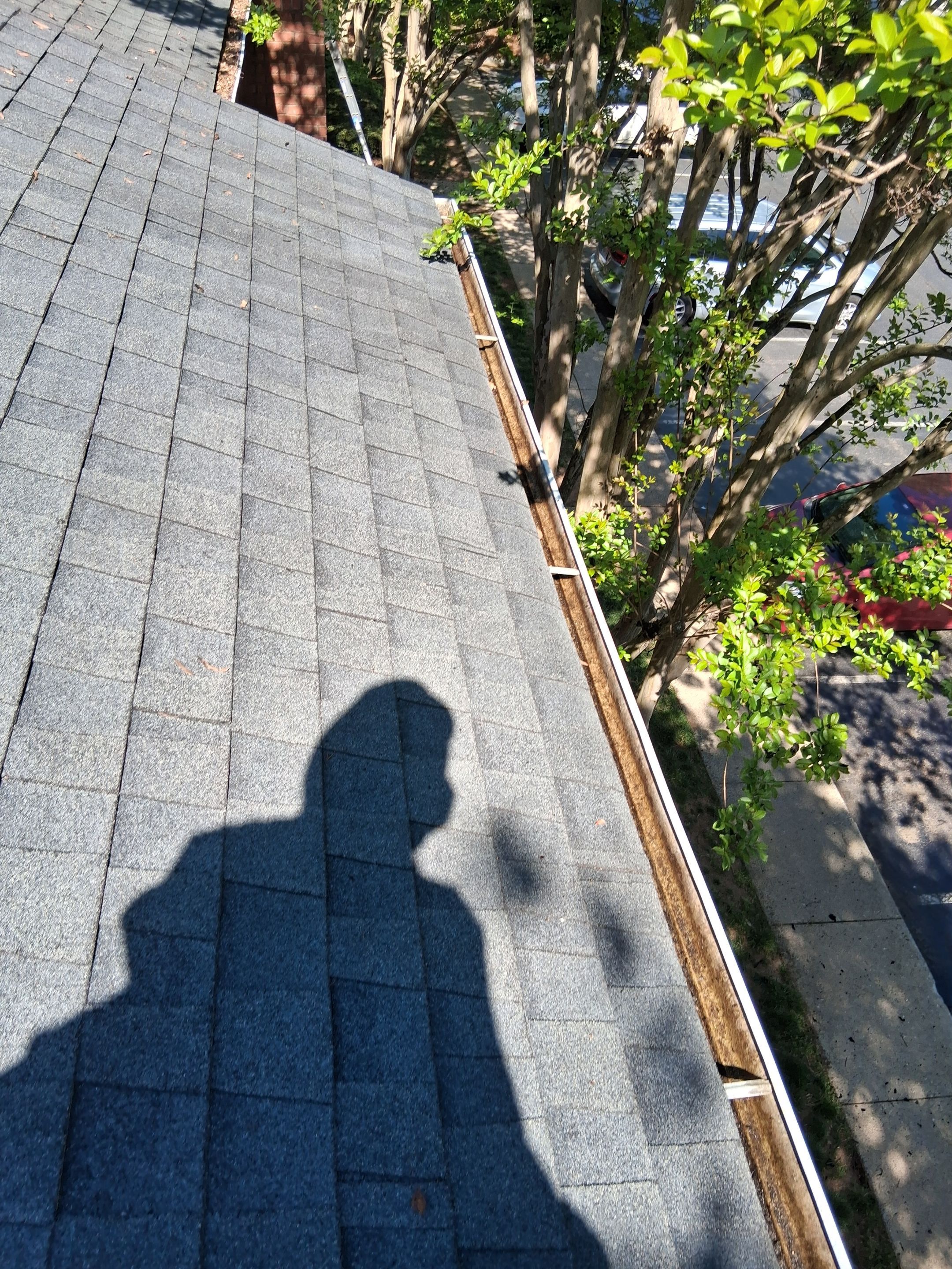 HOA gutter cleaning in Mooresville & Lake Norman, NC, after  photo showing full gutters.