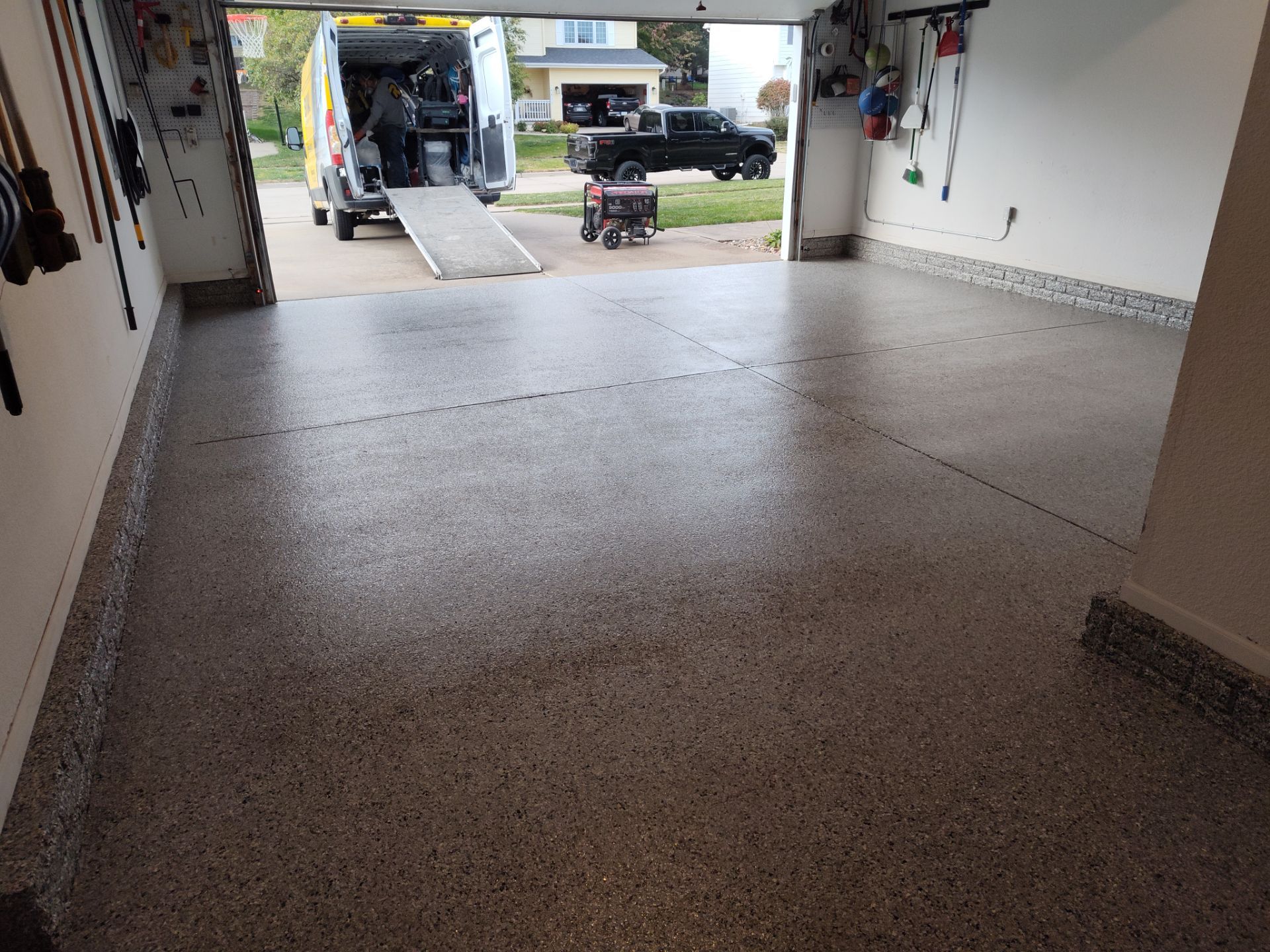 A Garage In One Day Keeps the Rock Salt Away! by Revival Concrete Coatings, LLC