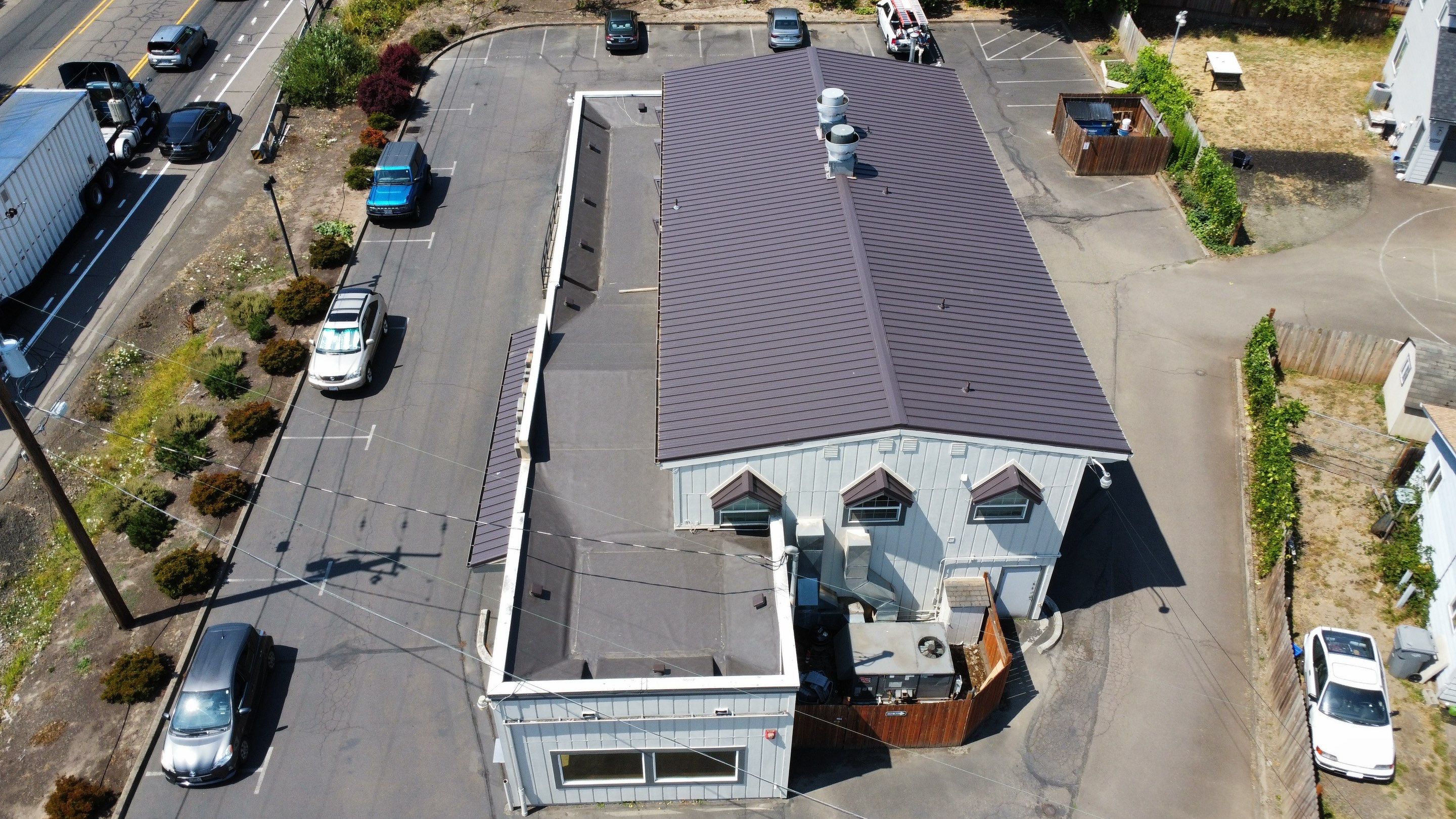Commercial Flat Roof Installation using Bruce and Dana Snap Lock Metal (Color: Brown) by Orezona Building & Roofing Company, Inc.