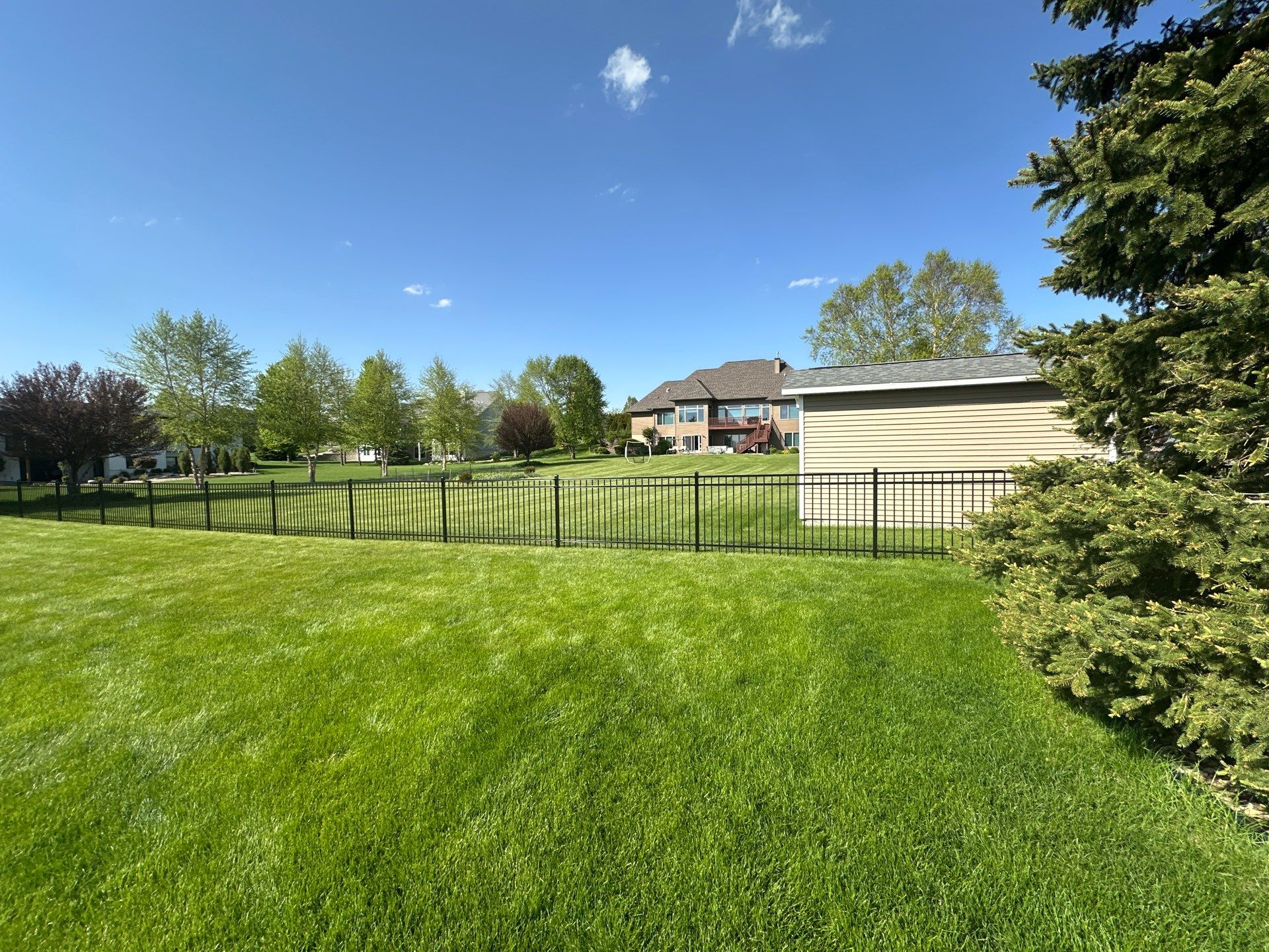 Black Ornamental Metal Picket Fence Installation in Waterloo by Perfect Picket Fence and Stain