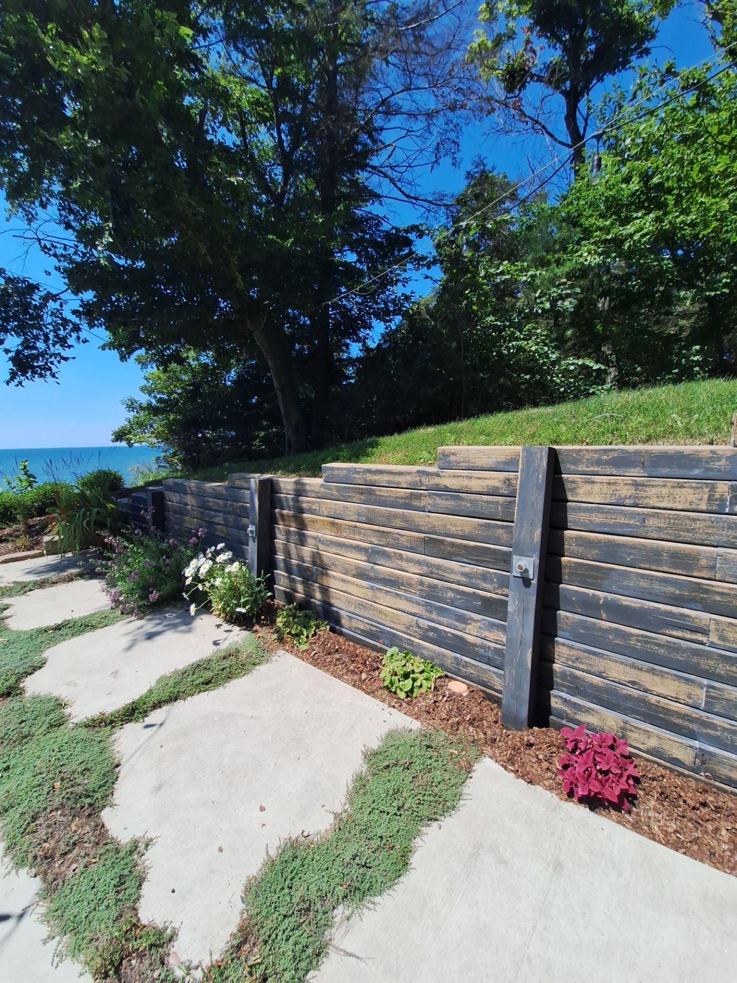 Exterior Retaining Wall Painting | Grand Haven, Michigan by Gordon Painting