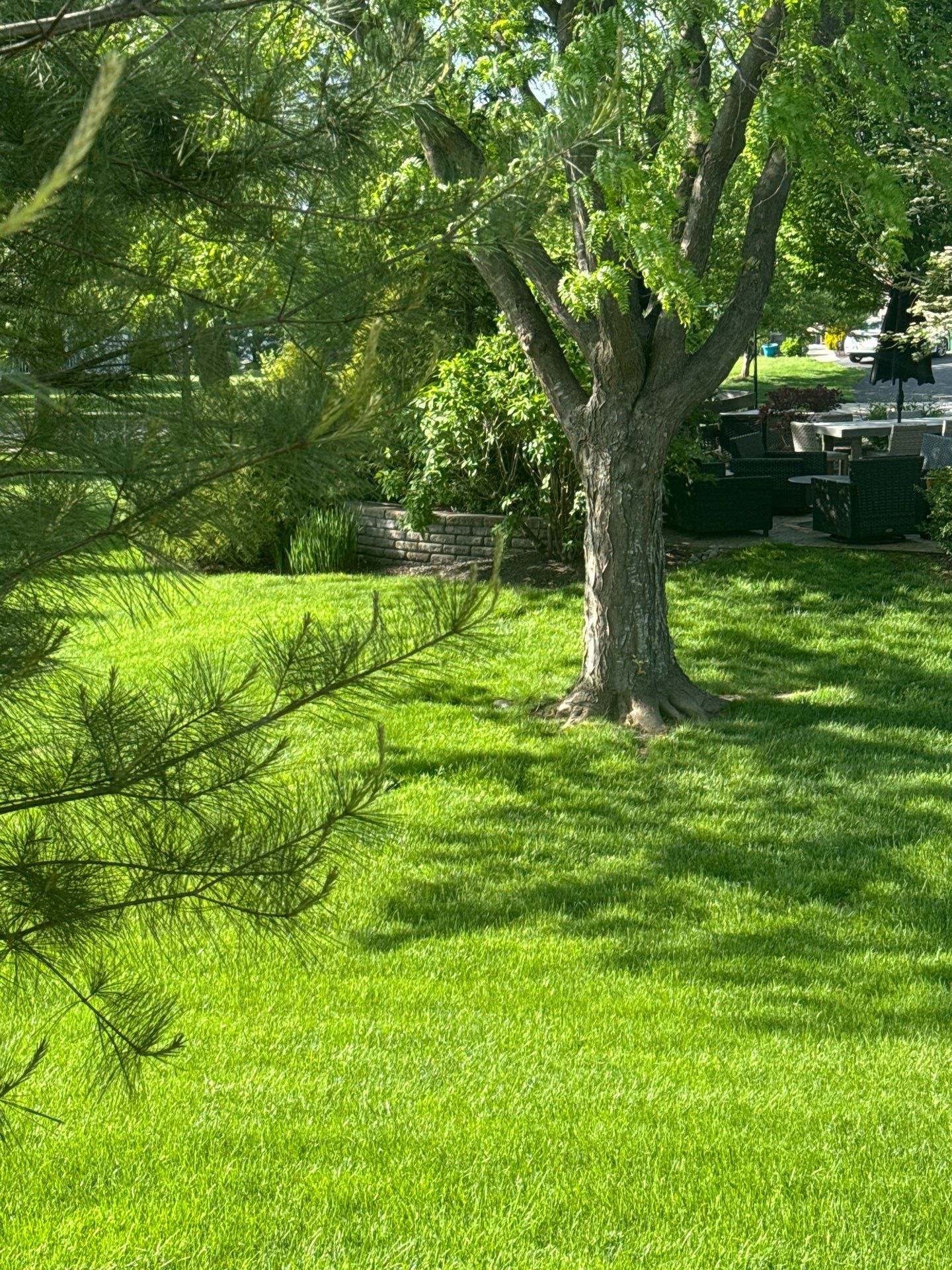 Backyard Retreat: Techo-Bloc Patio + Firepit Lounge by Saylor’s Lawn & Landscape