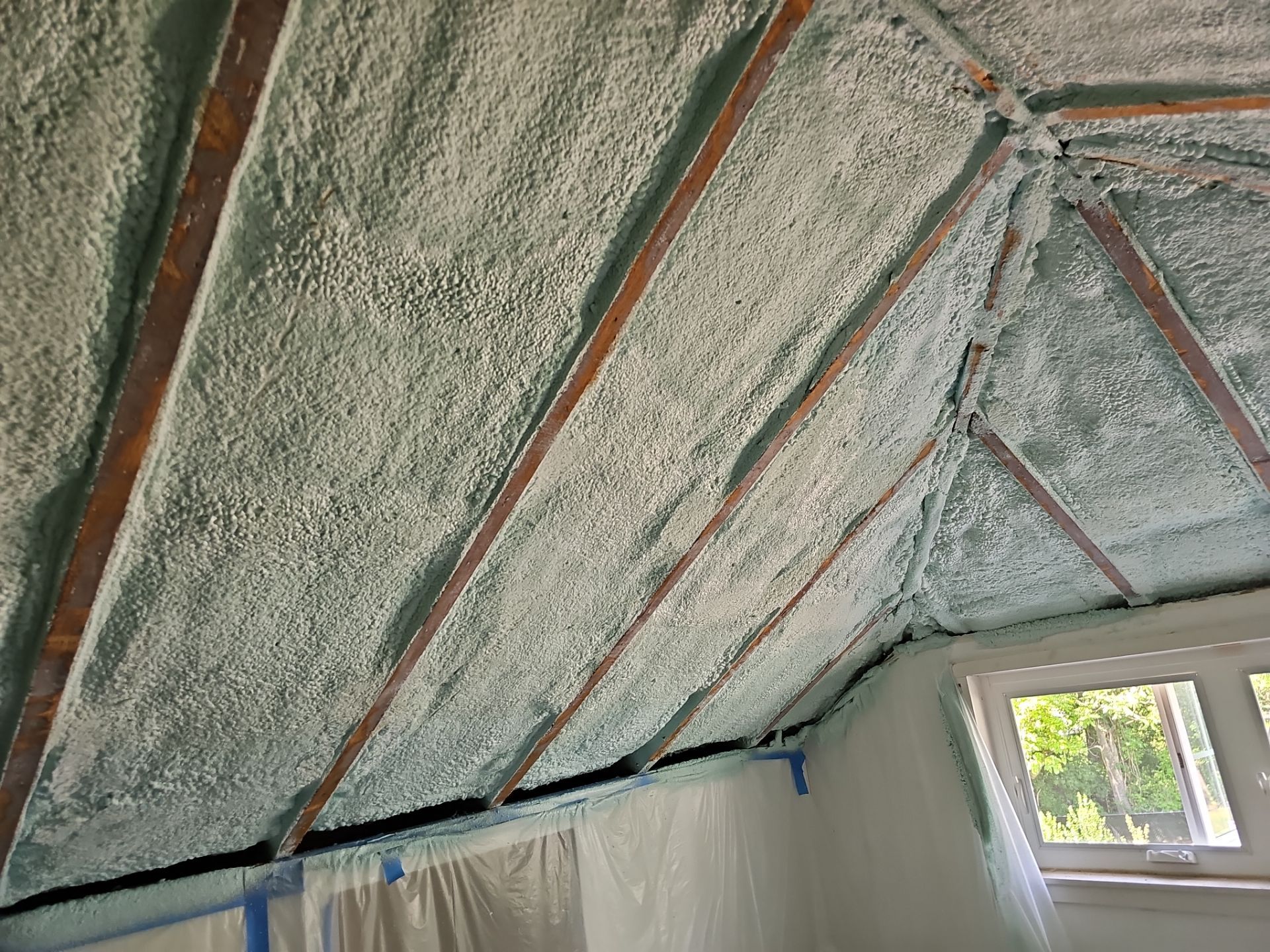 Attic Insulation using open cell spray foam by NYS Foam & Energy