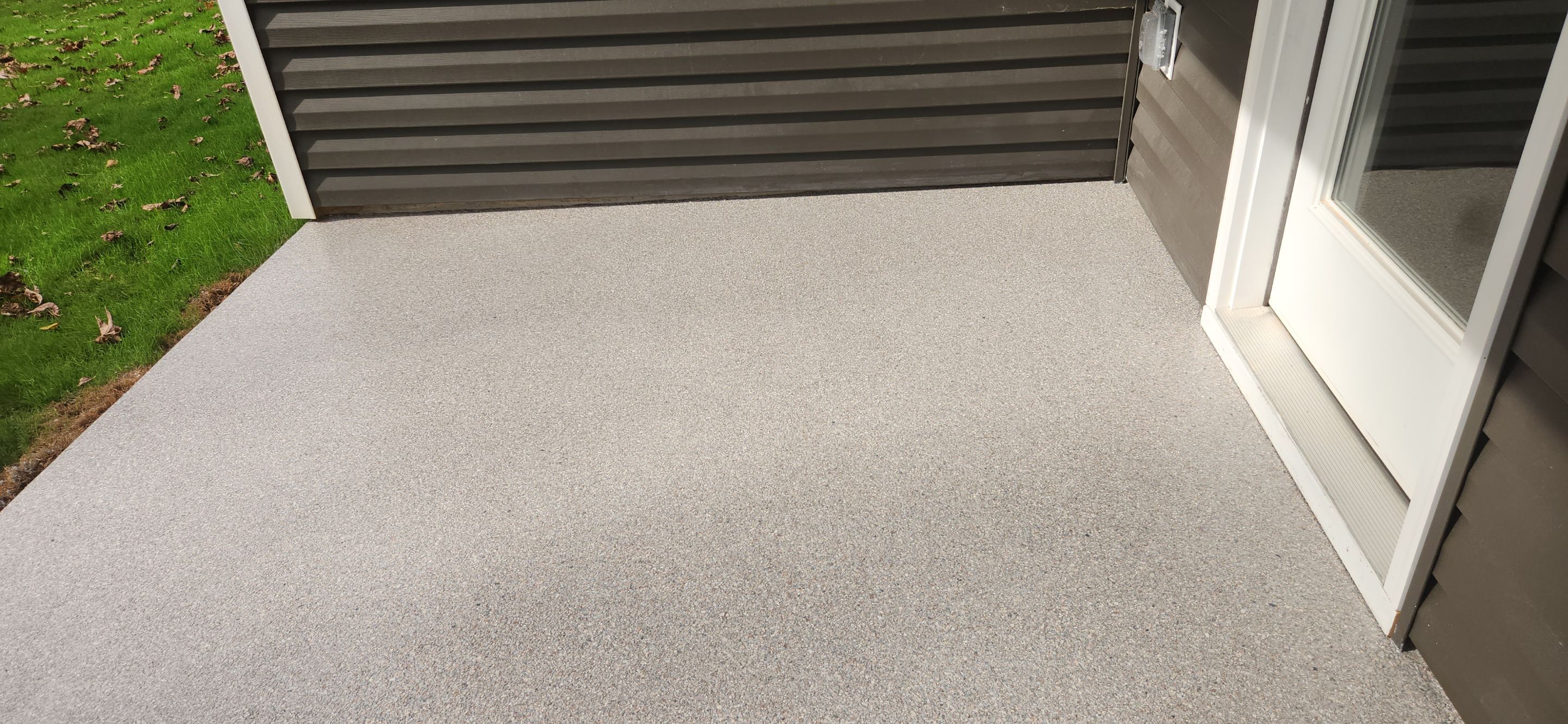 Garage & Back Patio using Domino & Pumice by Elite Floor Solutions