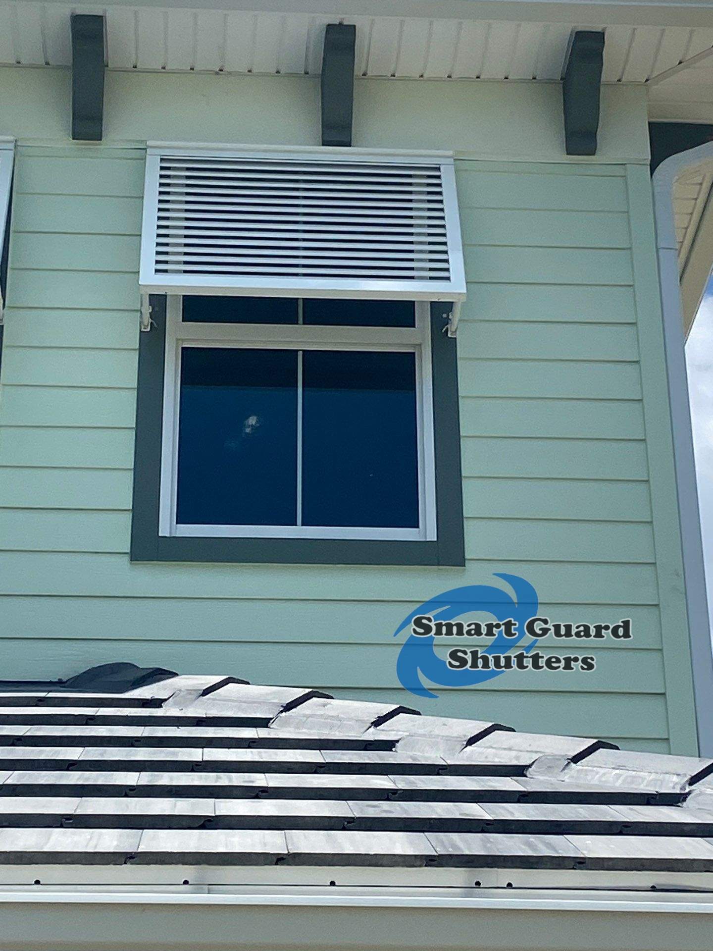 Decorative Bahama Shutters in Traffic White by Smart Guard Shutters