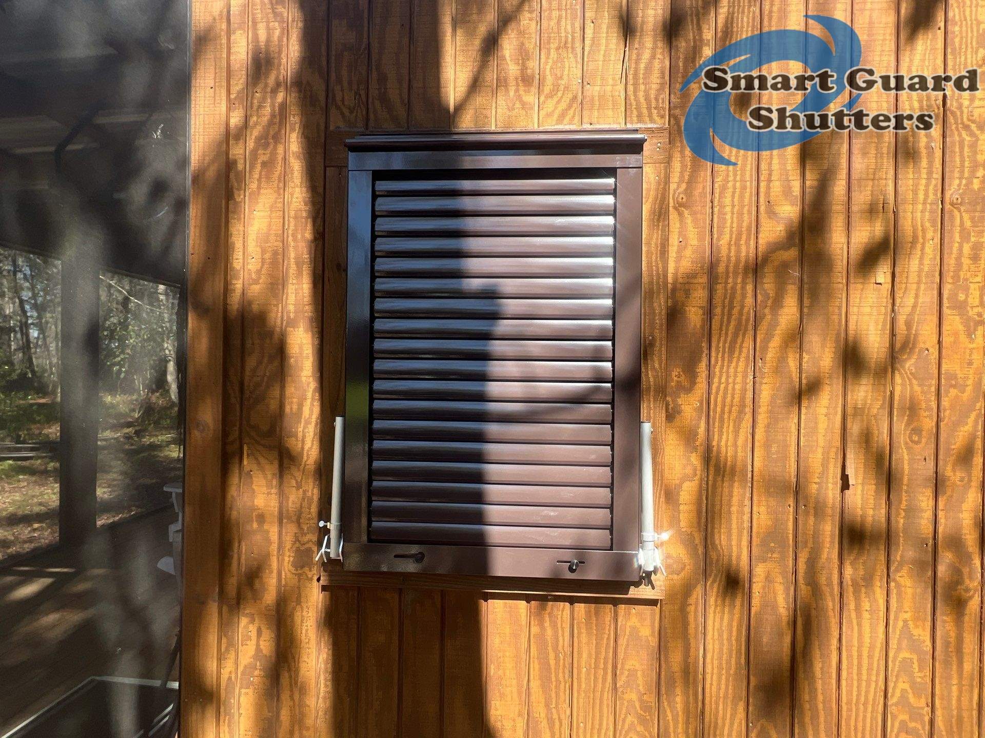 Hurricane Protection in Bronze/Grey Brown by Smart Guard Shutters