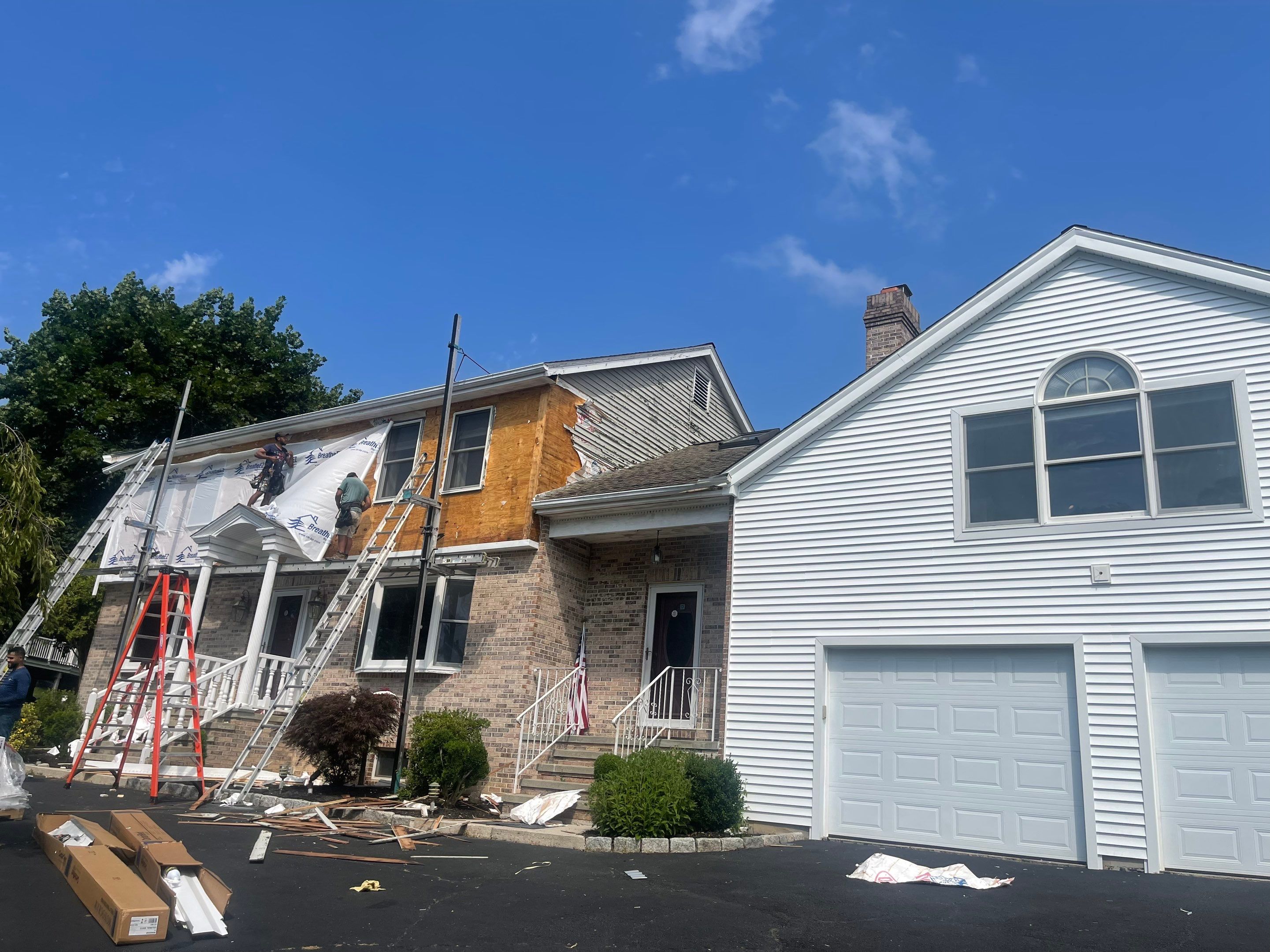 Siding Installation using Mainstreet Colonial & White gutters by A Plus Exterior