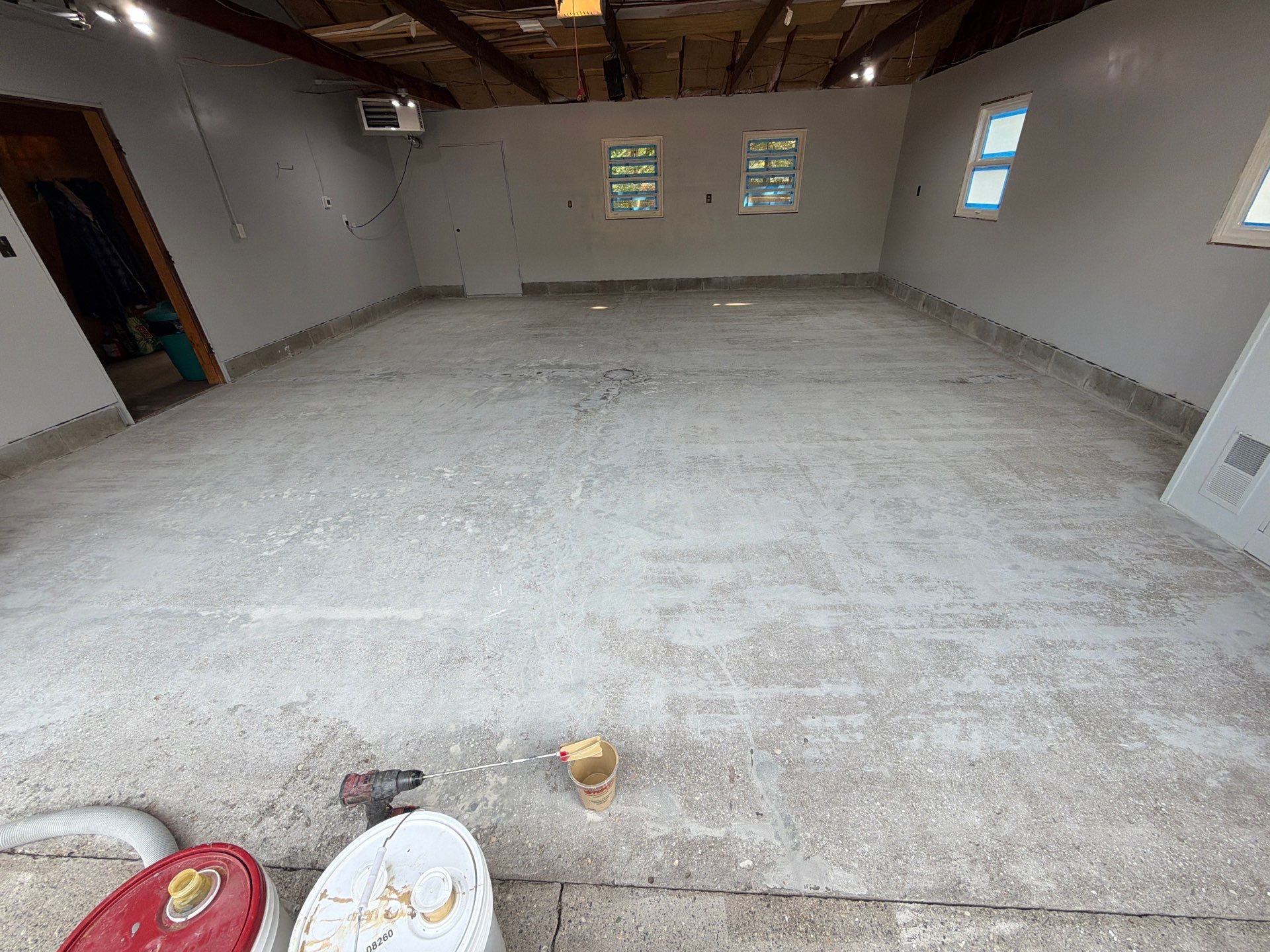 Garage Epoxy Flake Floor Installation and Exterior Siding Repairs in Muskegon by Gordon Painting