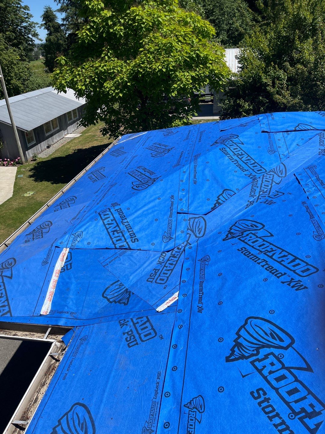 Residential Roofing Installation using 12" Prolok metal  by Top Notch Roofing Inc