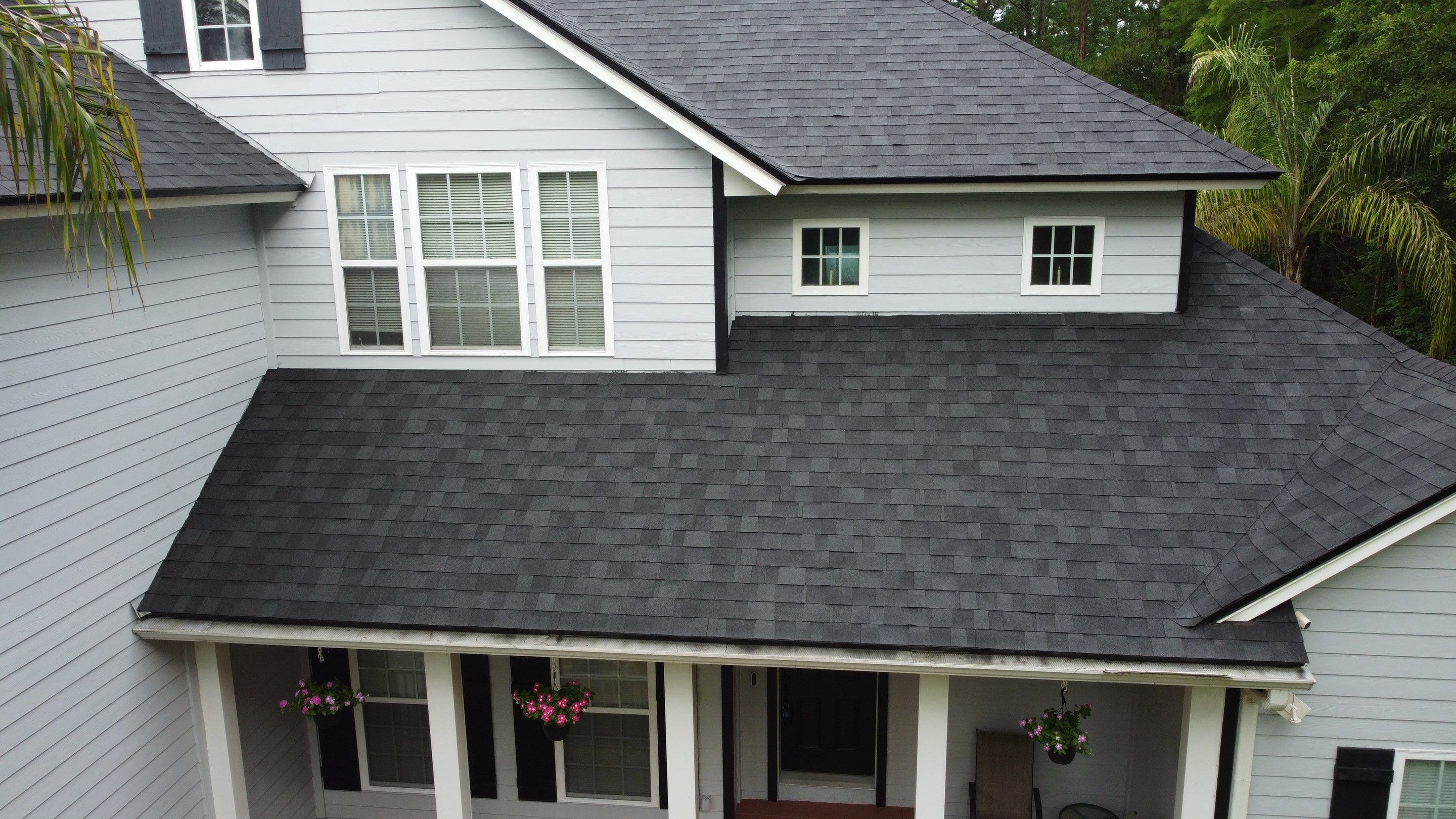 Complete Onyx Black Asphalt Shingle Roof Replacement and Skylight Installation in Jacksonville by Trinity Restoration and Roofing LLC