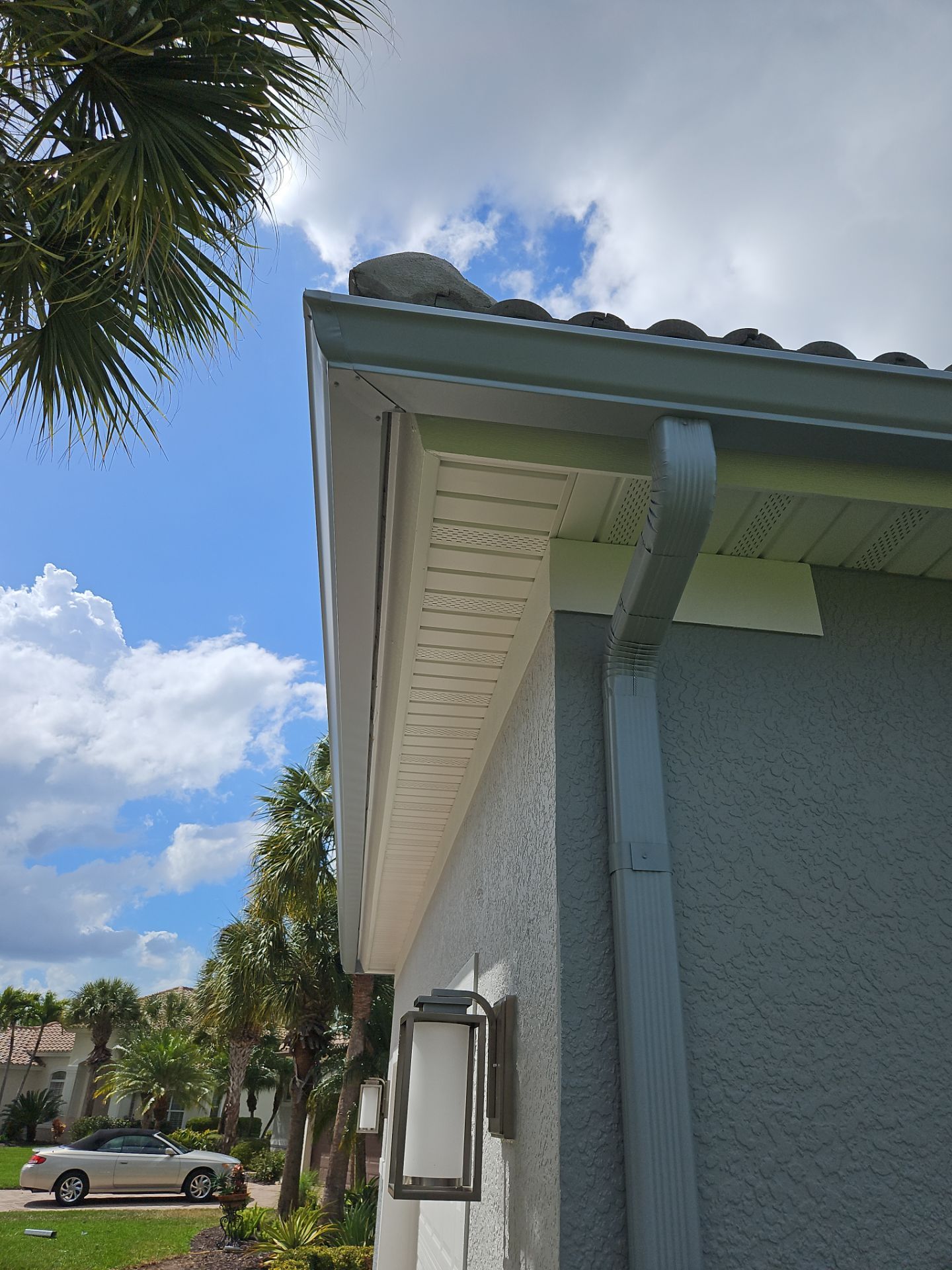 6-inch K-style Seamless Gutters and Splash Guard in Grey Color in Naples FL by Gutter Professors