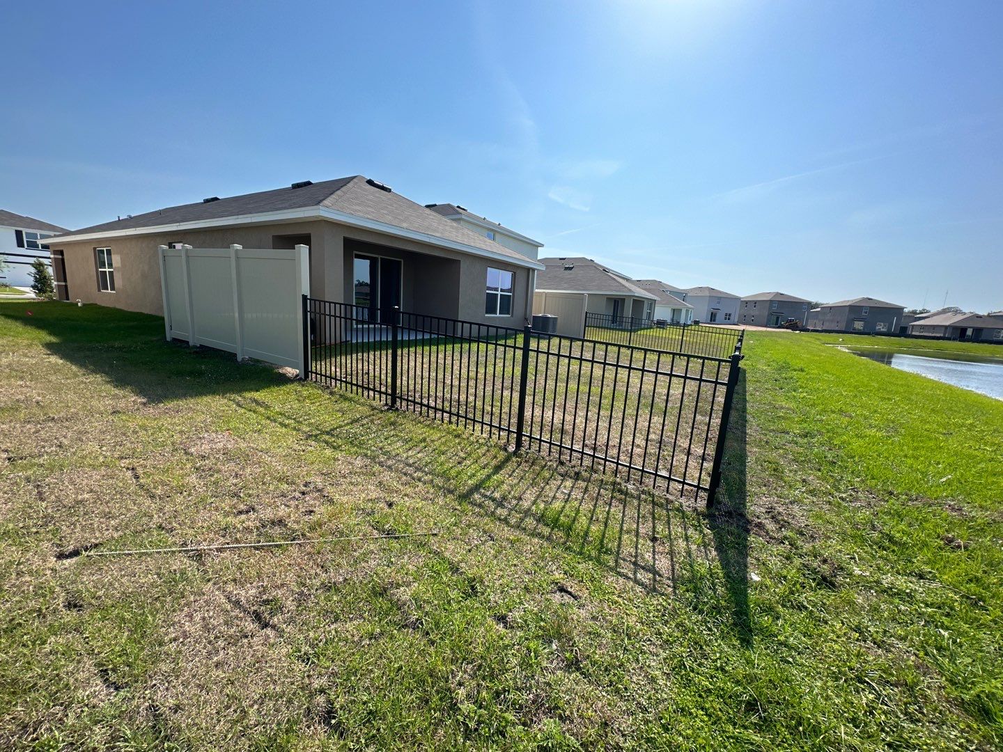 Aluminum Fence Installation using Vinyl Fence and Black 3 Rail Aluminum Fence  by Asap fence and gates, LLC