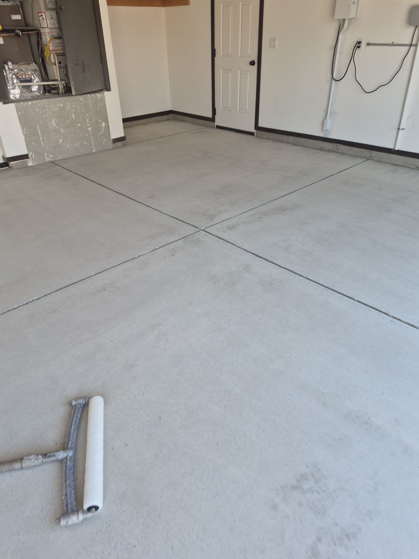 Polyurea Garage Floor Transformation with Slate Hybrid Finish in Post Falls by Croc Coatings, LLC